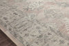 Featuring soft motifs in a carefully curated color palate of ivory, red, grey, and hints of blue, the Hathaway Java / Multi area rug captures the essence of one-of-a-kind vintage or antique area rug at an attractive price.