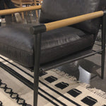 This Rowen Chair - Sonoma Black has buttery black seating of top-grain leather, with angular arms of exposed oak providing fresh contrast. A comfy, modern chair to add to any living room, bedroom, or other area.   Overall Dimensions: 27.50"w x 32.00"d x 31.00"h