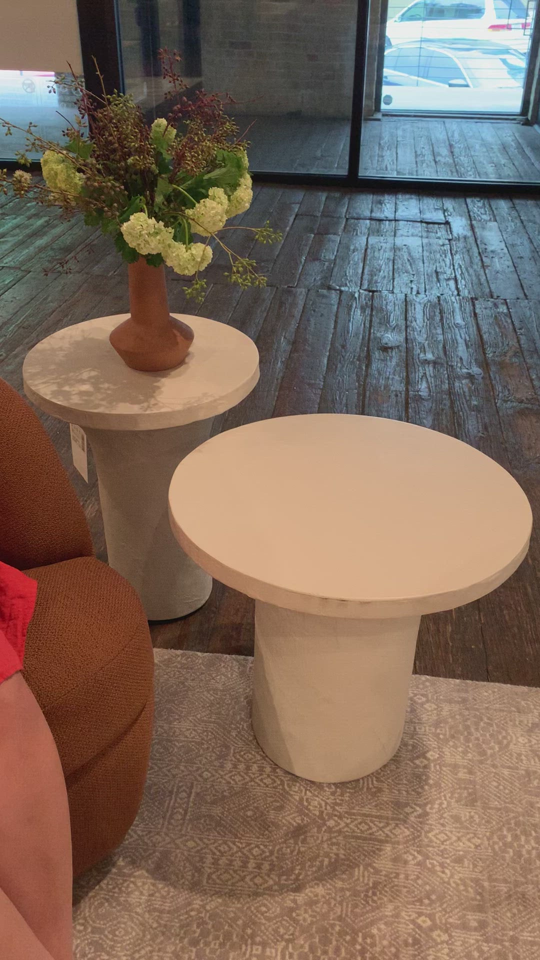 Load video: Made from plaster-molded concrete, a pedestal-style base supports a rounded tabletop of smooth, white-finished concrete in this Parra Low End Table - Plaster Molded Concrete. This brings a clean, adobe-inspired vibe to any living room or lounge area. Pair with the matching High End Table for a staggered look!   Overall Dimensions: 20.00&quot;w x 20.00&quot;d x 18.00&quot;h