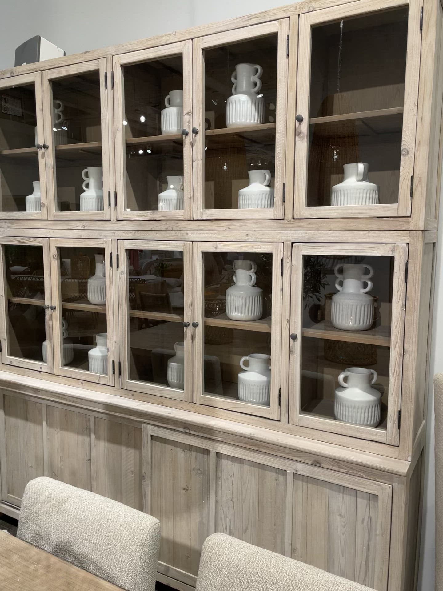 This Haley Cabinet has ample storage, with glass door panels opening to shelves and a bottom sliding door that opens to more shelves. Made from reclaimed pine with a white wash grey sealed finish, this brings an antique feel to any room.  Reclaimed Pine  White Wash Grey Sealed Finish  Flat Glass Door Panels