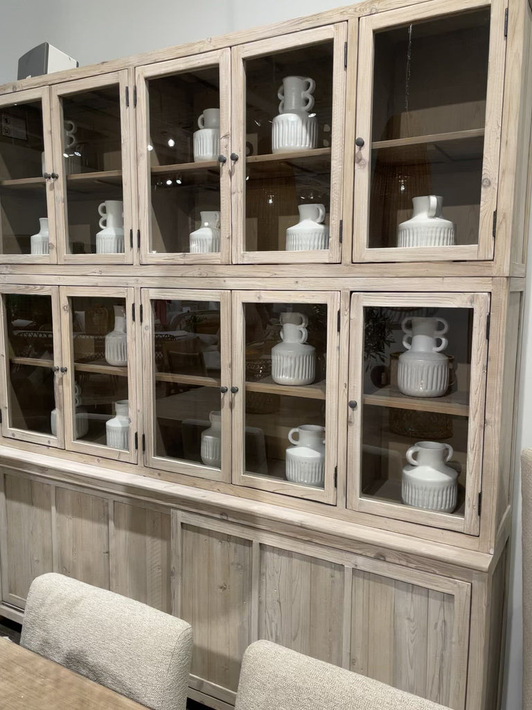 This Haley Cabinet has ample storage, with glass door panels opening to shelves and a bottom sliding door that opens to more shelves. Made from reclaimed pine with a white wash grey sealed finish, this brings an antique feel to any room.  Reclaimed Pine  White Wash Grey Sealed Finish  Flat Glass Door Panels