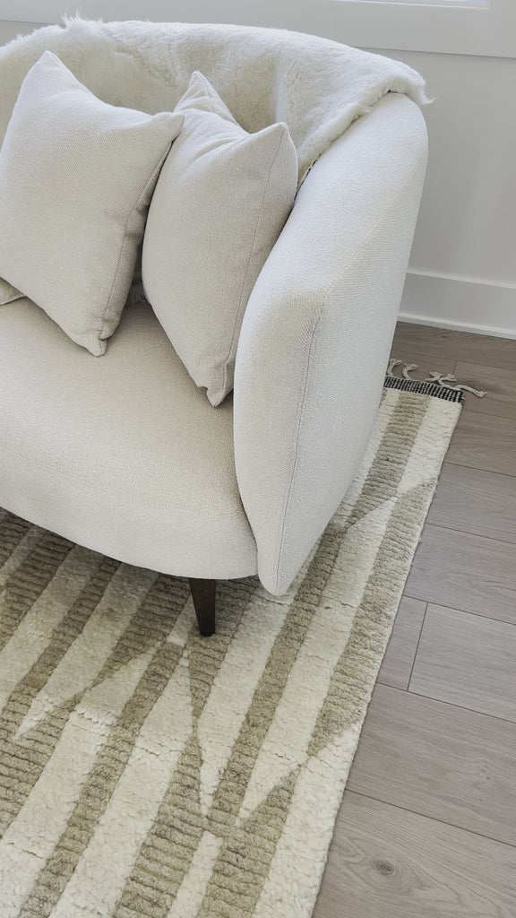 This curvy, Italian-inspired Luna Chaise exudes attitude. This features exclusive performance-grade ivory boucle in a striking, sultry S shape. Dual pillows for a fine finishing touch for any bedroom, office, or living room. Amethyst Home provides interior design, new home construction design consulting, vintage area rugs, and lighting in the Winter Garden metro area.