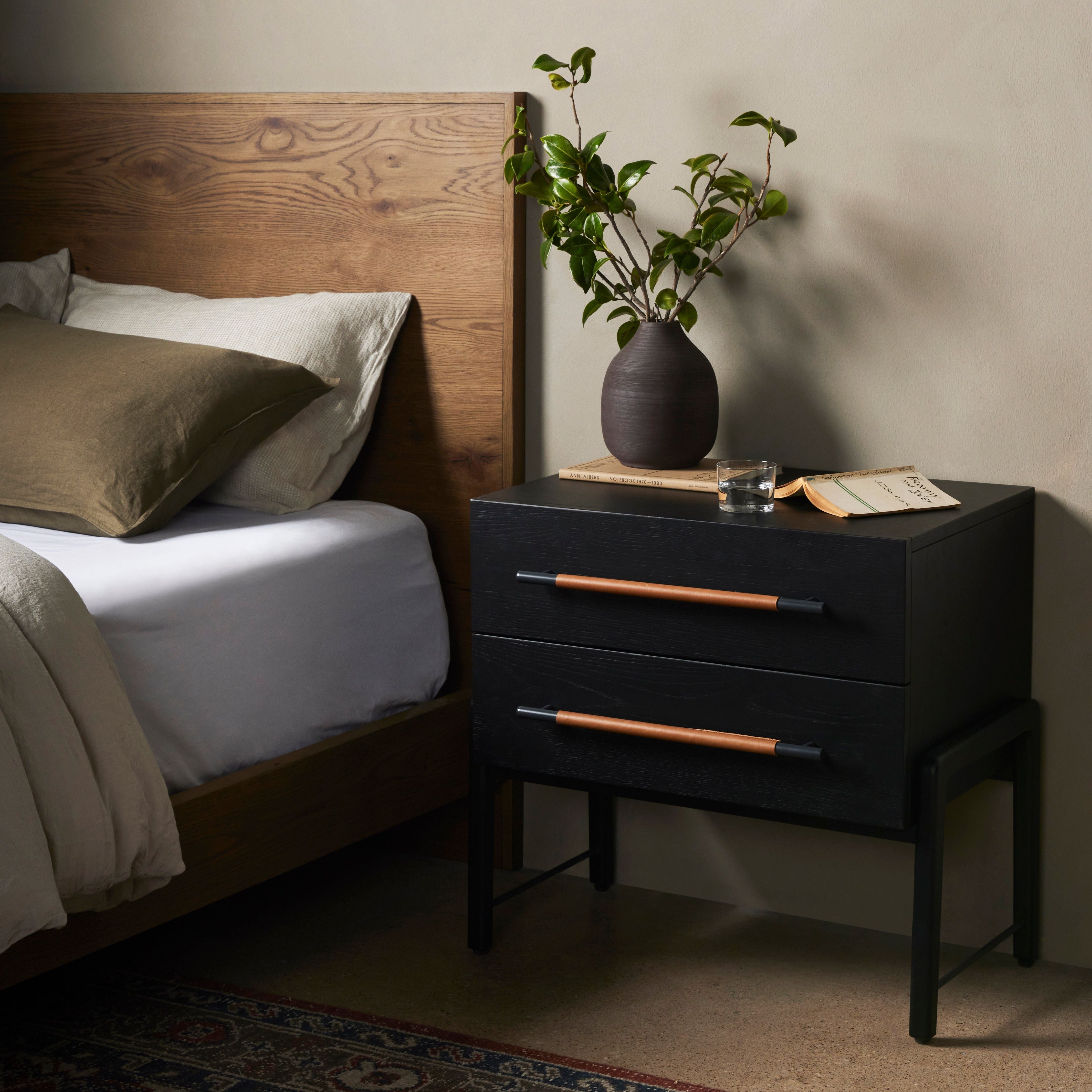 The light-finished oak of this Rosedale Nightstand brings a clean, brightness to any room. We love how the two spacious drawers have iron hardware wrapped in a gorgeous, tan leather. The dimension legs with iron connecting them bring a unique look to your bedroom or other area! Amethyst Home provides interior design, new home construction design consulting, vintage area rugs, and lighting in the Los Angeles metro area.