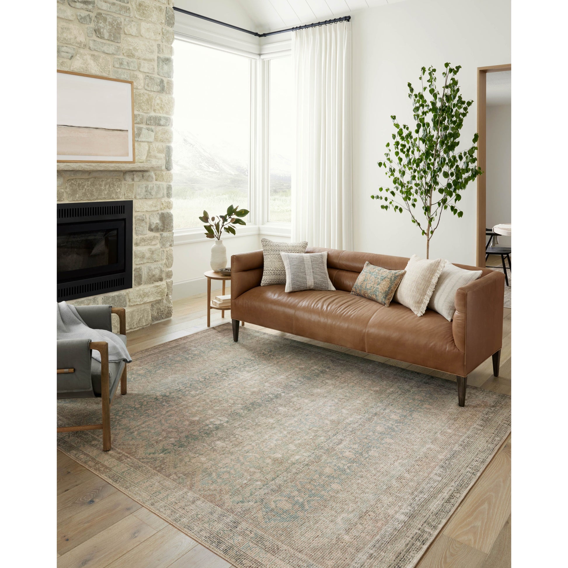 The Angela Rose x Loloi Aubrey AUB-03 Jade / Natural rug is the vintage-inspired area rug that makes visitors do double takes. The distressed pattern is printed with uncanny precision, while the ombre-fading and warm palette create an inviting, lived-in look. Amethyst favorite! Amethyst Home provides interior design services, furniture, rugs, and lighting in the Calabasas metro area.