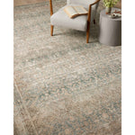 Featuring Angela Rose x Loloi Aubrey Jade / Natural Rug by Loloi at Amethyst Home. The Angela Rose x Loloi Aubrey Jade / Natural rug is the vintage-inspired area rug that makes visitors do double takes. The distressed pattern is printed with uncanny precision, while the ombre-fading and warm palette create an inviting, lived-in look. This is an incredibly versatile rug for busy living rooms. Amethyst Home provides interior design services, furniture, rugs, and lighting in the Charlotte metro area.