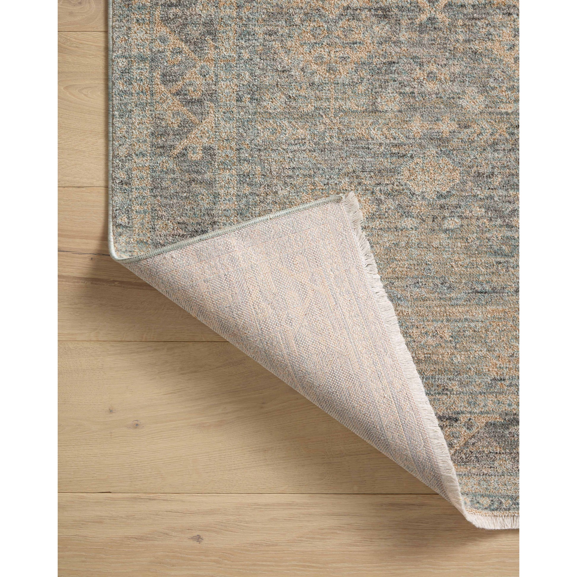 The Angela Rose x Loloi Blake BLA-01 Sky / Beige rug features traditional motifs that have softened into the background, making it an effortless neutral in any room. Muted earth-toned palettes complement a range of furniture, while subtle cream-colored fringe at the edges add texture and framing. Amethyst favorite! Amethyst Home provides interior design services, furniture, rugs, and lighting in the Boston metro area.