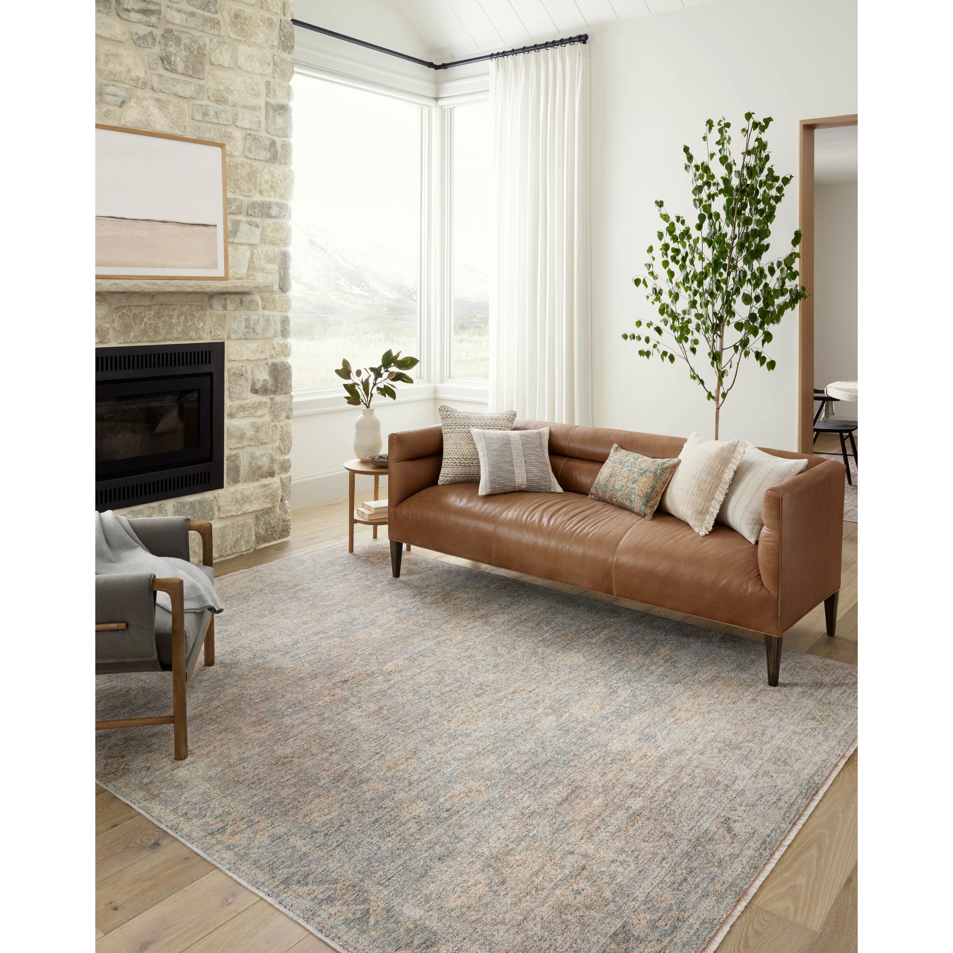 The Angela Rose x Loloi Blake BLA-01 Sky / Beige rug features traditional motifs that have softened into the background, making it an effortless neutral in any room. Muted earth-toned palettes complement a range of furniture, while subtle cream-colored fringe at the edges add texture and framing. Amethyst favorite! Amethyst Home provides interior design services, furniture, rugs, and lighting in the Nashville metro area.