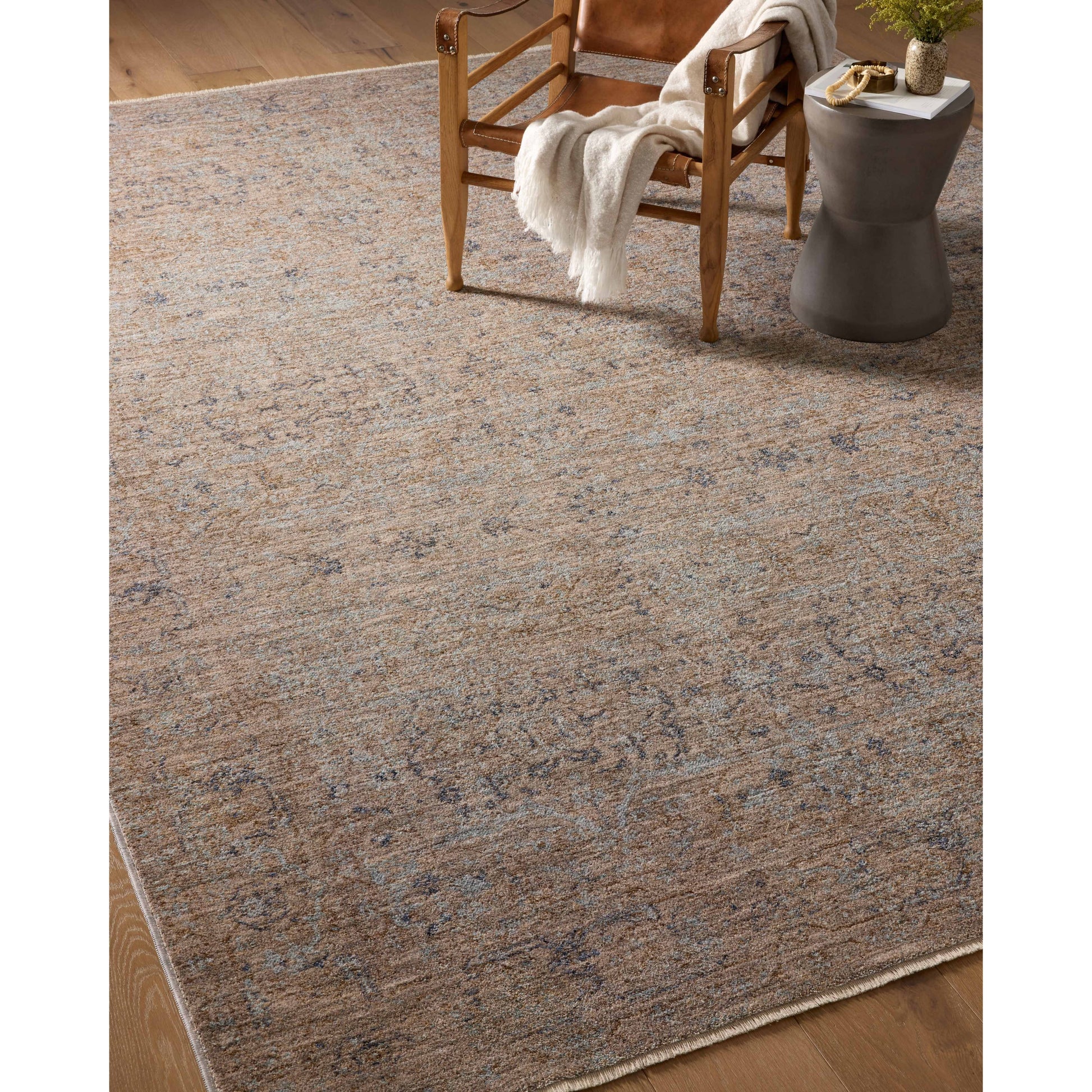 The Angela Rose x Loloi Blake BLA-03 Taupe / Blue rug features traditional motifs that have softened into the background, making it an effortless neutral in any room. Muted earth-toned palettes complement a range of furniture, while subtle cream-colored fringe at the edges add texture and framing. Amethyst favorite! Amethyst Home provides interior design services, furniture, rugs, and lighting in the Des Moines metro area.