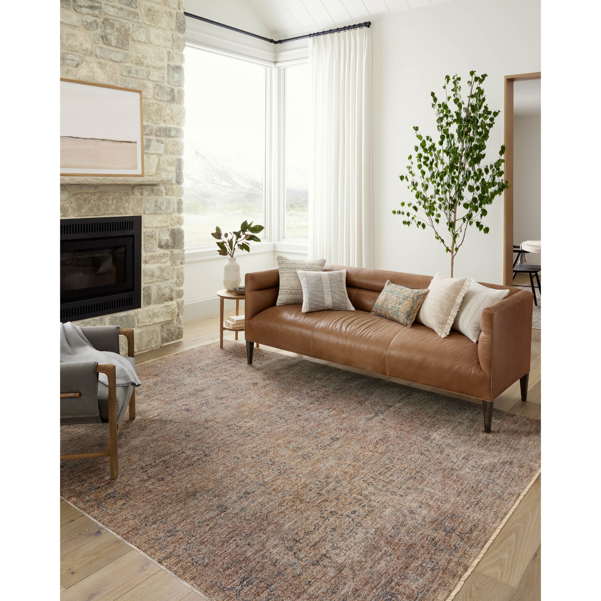 The Angela Rose x Loloi Blake BLA-03 Taupe / Blue rug features traditional motifs that have softened into the background, making it an effortless neutral in any room. Muted earth-toned palettes complement a range of furniture, while subtle cream-colored fringe at the edges add texture and framing. Amethyst favorite! Amethyst Home provides interior design services, furniture, rugs, and lighting in the Omaha metro area.