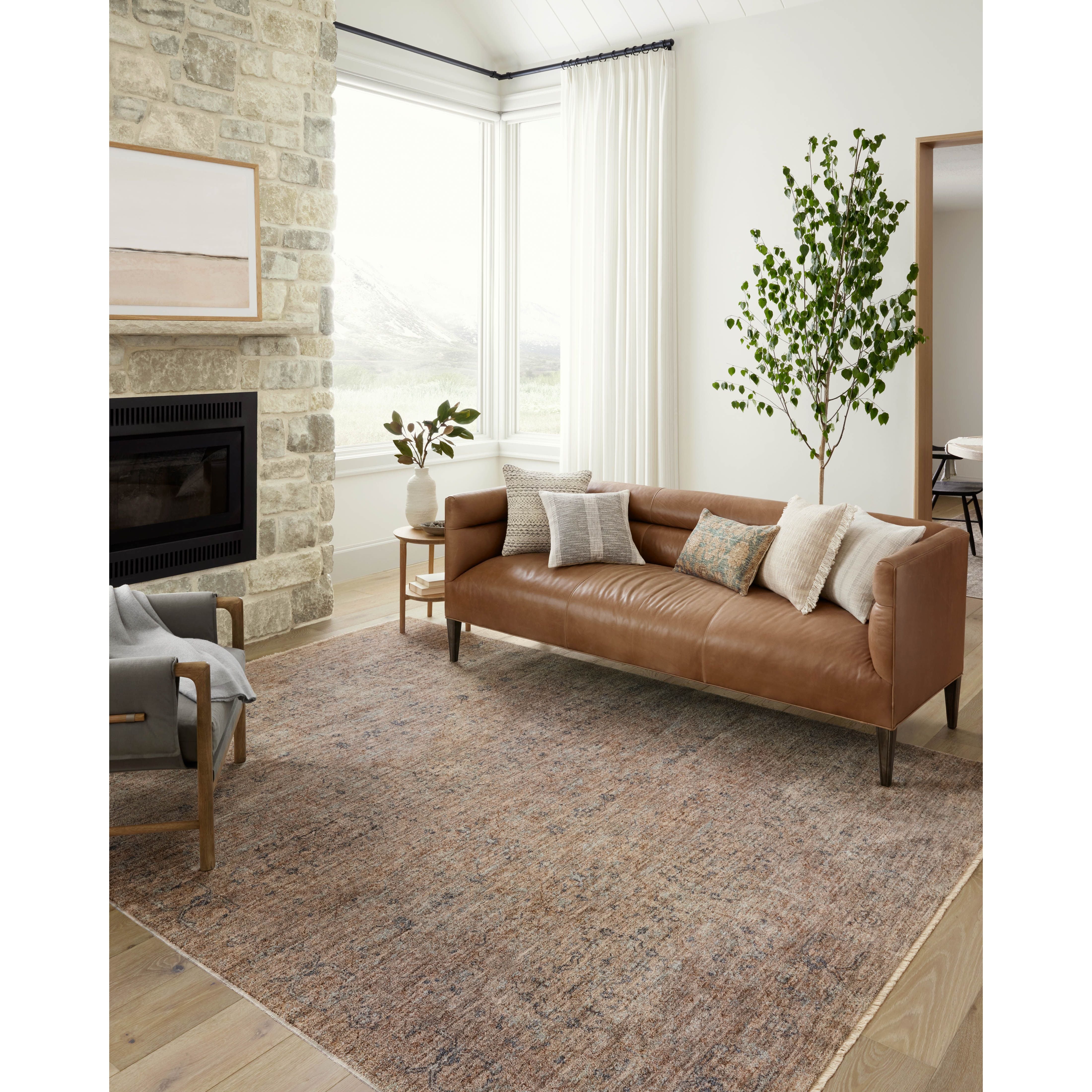 The Angela Rose x Loloi Blake BLA-03 Taupe / Blue rug features traditional motifs that have softened into the background, making it an effortless neutral in any room. Muted earth-toned palettes complement a range of furniture, while subtle cream-colored fringe at the edges add texture and framing. Amethyst favorite! Amethyst Home provides interior design services, furniture, rugs, and lighting in the Omaha metro area.