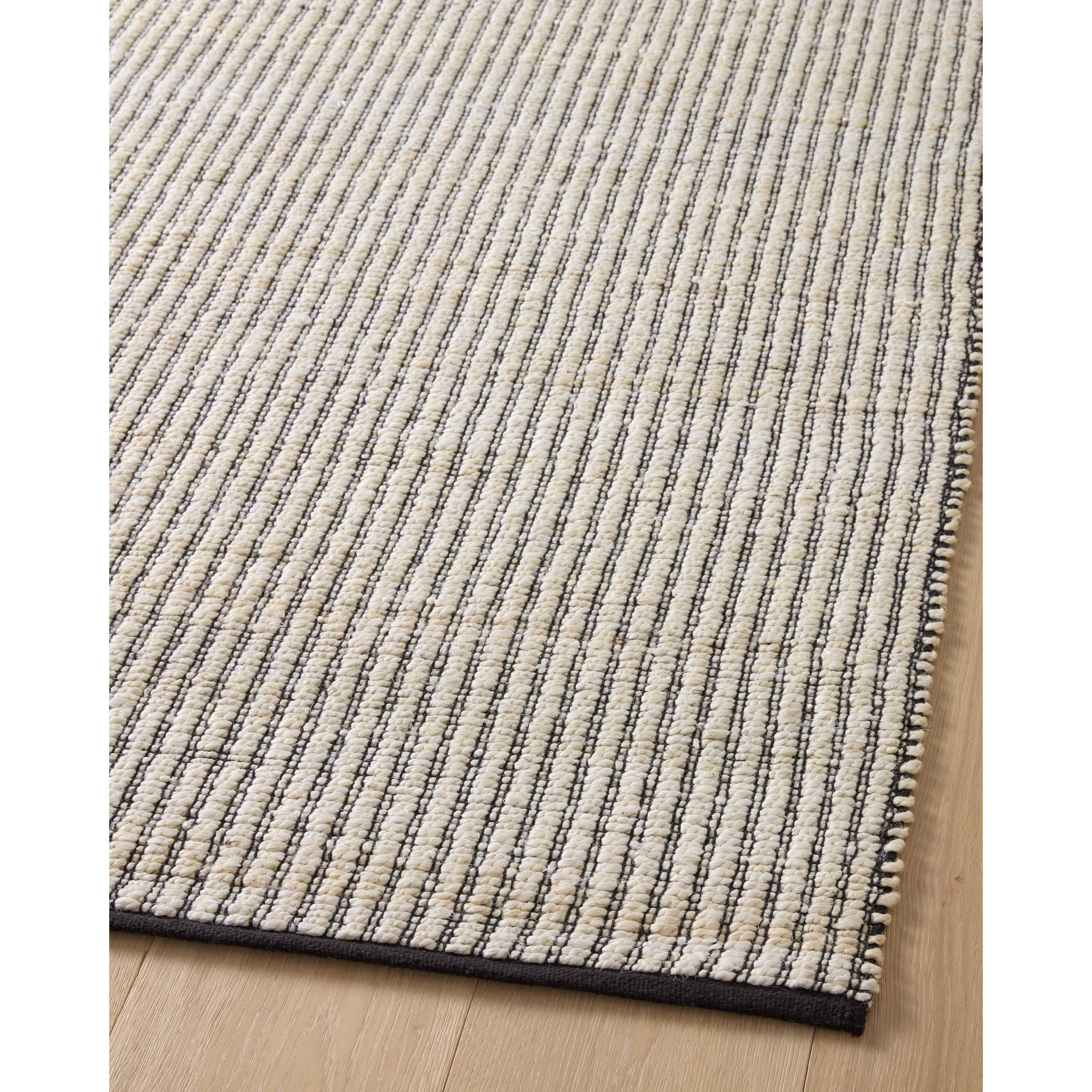 Featuring Angela Rose x Loloi Colton Ivory / Black Rug by Loloi at Amethyst Home. The Angela Rose x Loloi Colton Ivory / Black rug is a new take on the staple jute rug, blended with cotton for added softness. In a range of linear designs in modern earth tones, Colton can add visual interest to a room or serve as a gently textured neutral. This collection is hand-woven in India and GoodWeave cer. Amethyst Home provides interior design services, furniture, rugs, and lighting in the Fargo metro area.