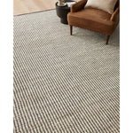 Featuring Angela Rose x Loloi Colton Ivory / Black Rug by Loloi at Amethyst Home. The Angela Rose x Loloi Colton Ivory / Black rug is a new take on the staple jute rug, blended with cotton for added softness. In a range of linear designs in modern earth tones, Colton can add visual interest to a room or serve as a gently textured neutral. This collection is hand-woven in India and GoodWea. Amethyst Home provides interior design services, furniture, rugs, and lighting in the Winter Park metro area.
