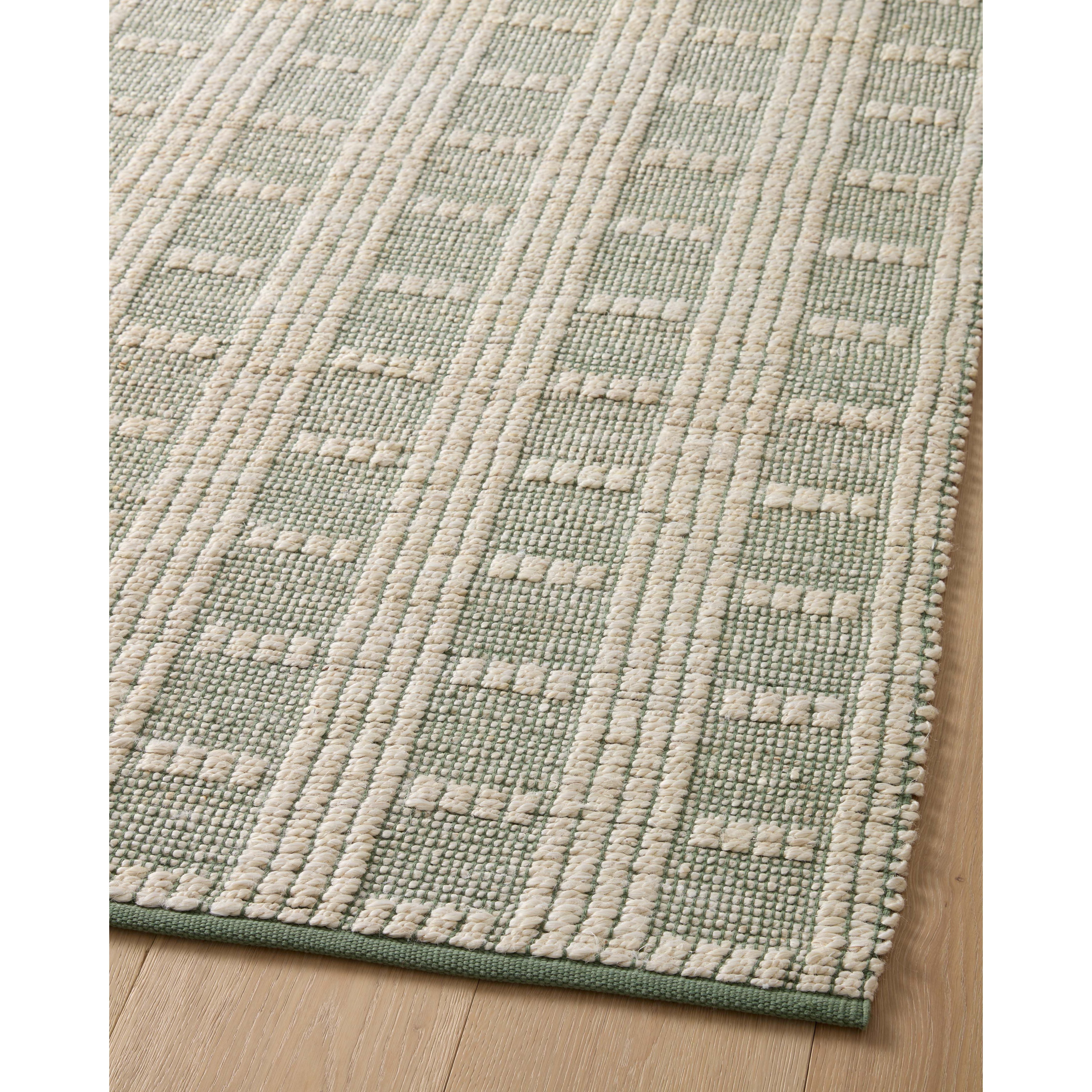 Featuring Angela Rose x Loloi Colton Ivory / Sage Rug by Loloi at Amethyst Home. The Angela Rose x Loloi Colton Ivory / Sage rug is a new take on the staple jute rug, blended with cotton for added softness. In a range of linear designs in modern earth tones, Colton can add visual interest to a room or serve as a gently textured neutral. This collection is hand-woven in India and GoodWeave . Amethyst Home provides interior design services, furniture, rugs, and lighting in the Des Moines metro area.