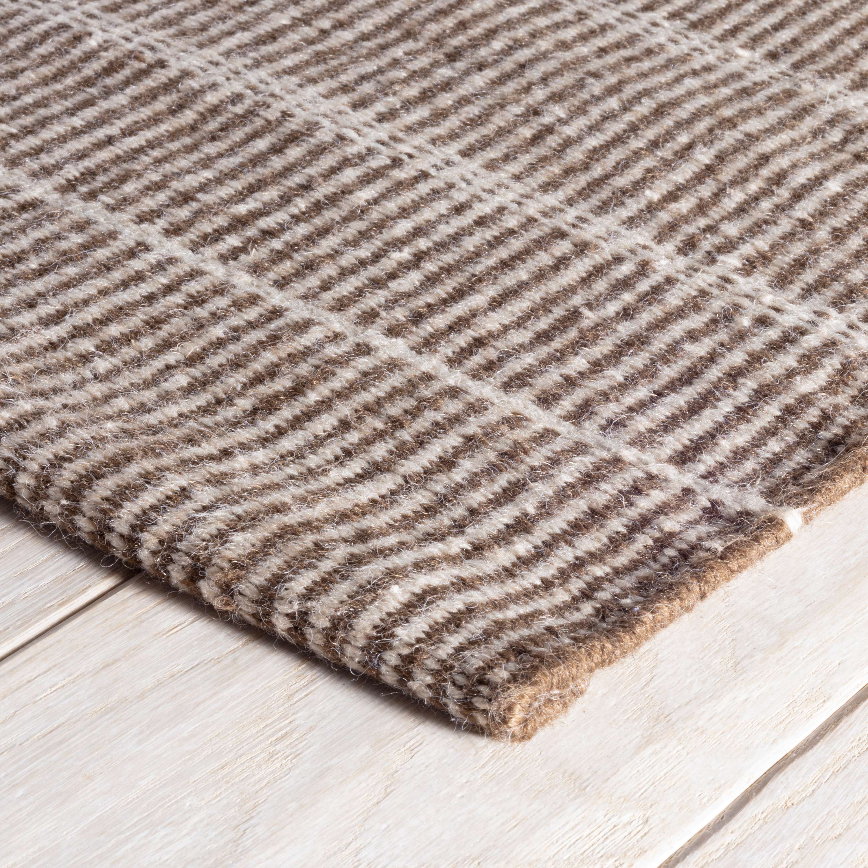 Part of our Designer Favorites collection of go-to rugs in timeless styles and a variety of durable constructions.<br><br>Part of our Bunny Williams collection, this delicately striped, dark brown indoor/outdoor rug was inspired by an antique rug sample from the designer's own personal collection. Due to the handmade nature of this area rug, variations in color are expected. Amethyst Home provides interior design, new construction, custom furniture, and area rugs in the Austin metro area.