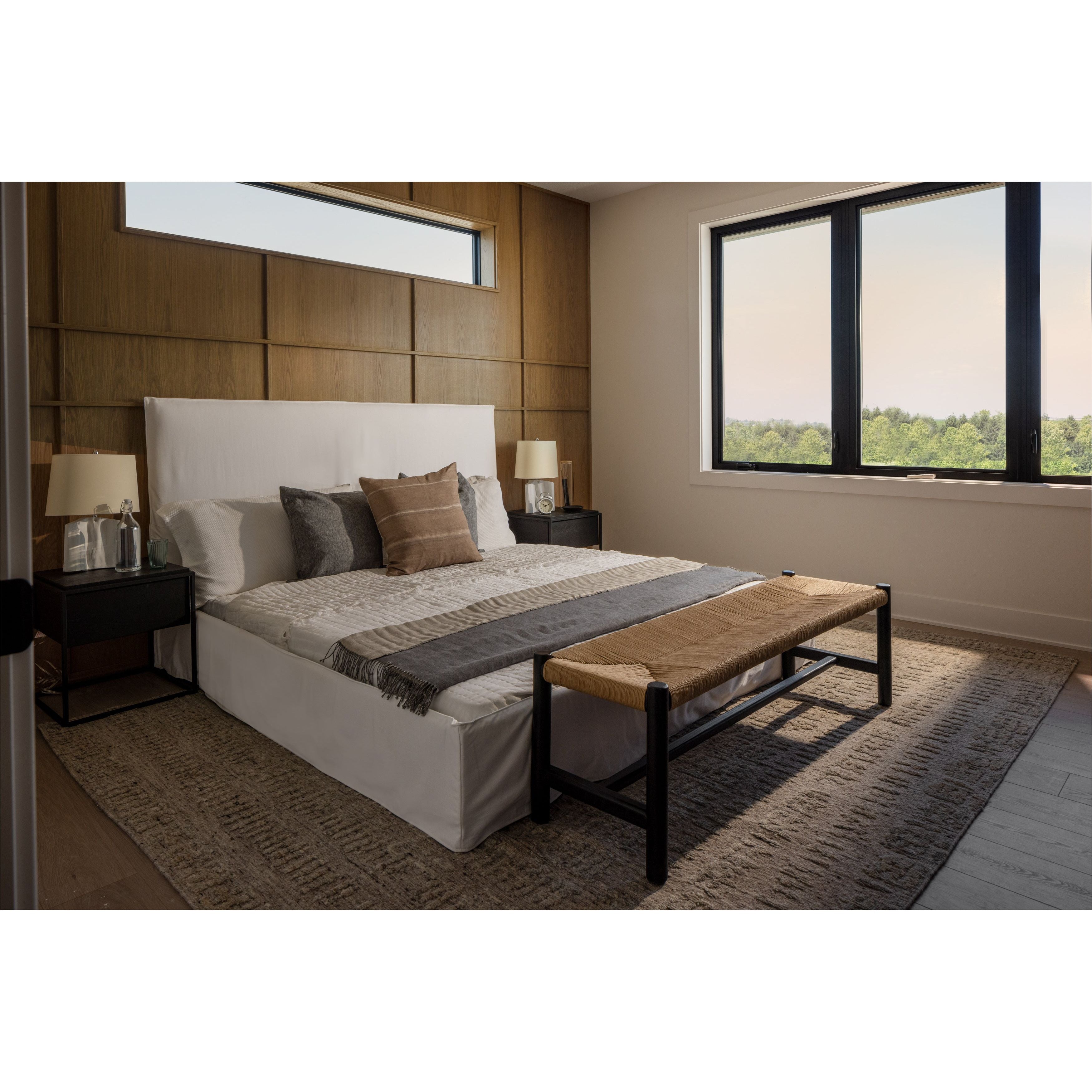 Cisco Brothers April Bed is designed and constructed in Los Angeles. The pinched edges and clean lines bring a modern, minimalist feel to any bedroom. Photographed in White Denim and Bengal Pin Striped Indigo. Amethyst Home provides interior design, new home construction design consulting, vintage area rugs, and lighting in the Monterey metro area.