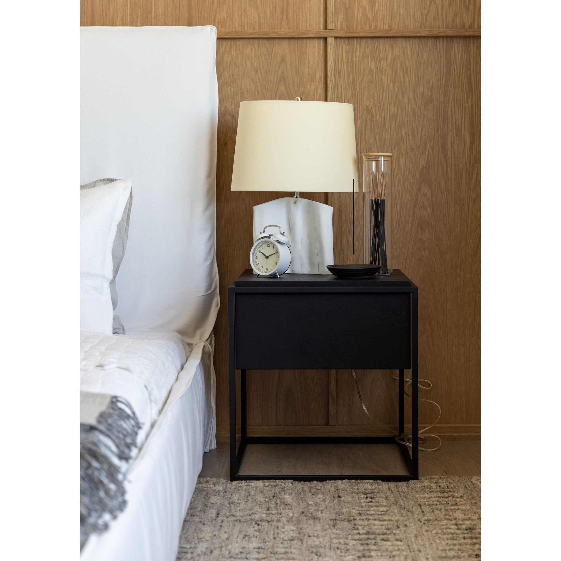 Cisco Brothers April Bed is designed and constructed in Los Angeles. The pinched edges and clean lines bring a modern, minimalist feel to any bedroom. Photographed in White Denim and Bengal Pin Striped Indigo. Amethyst Home provides interior design, new home construction design consulting, vintage area rugs, and lighting in the Washington metro area.