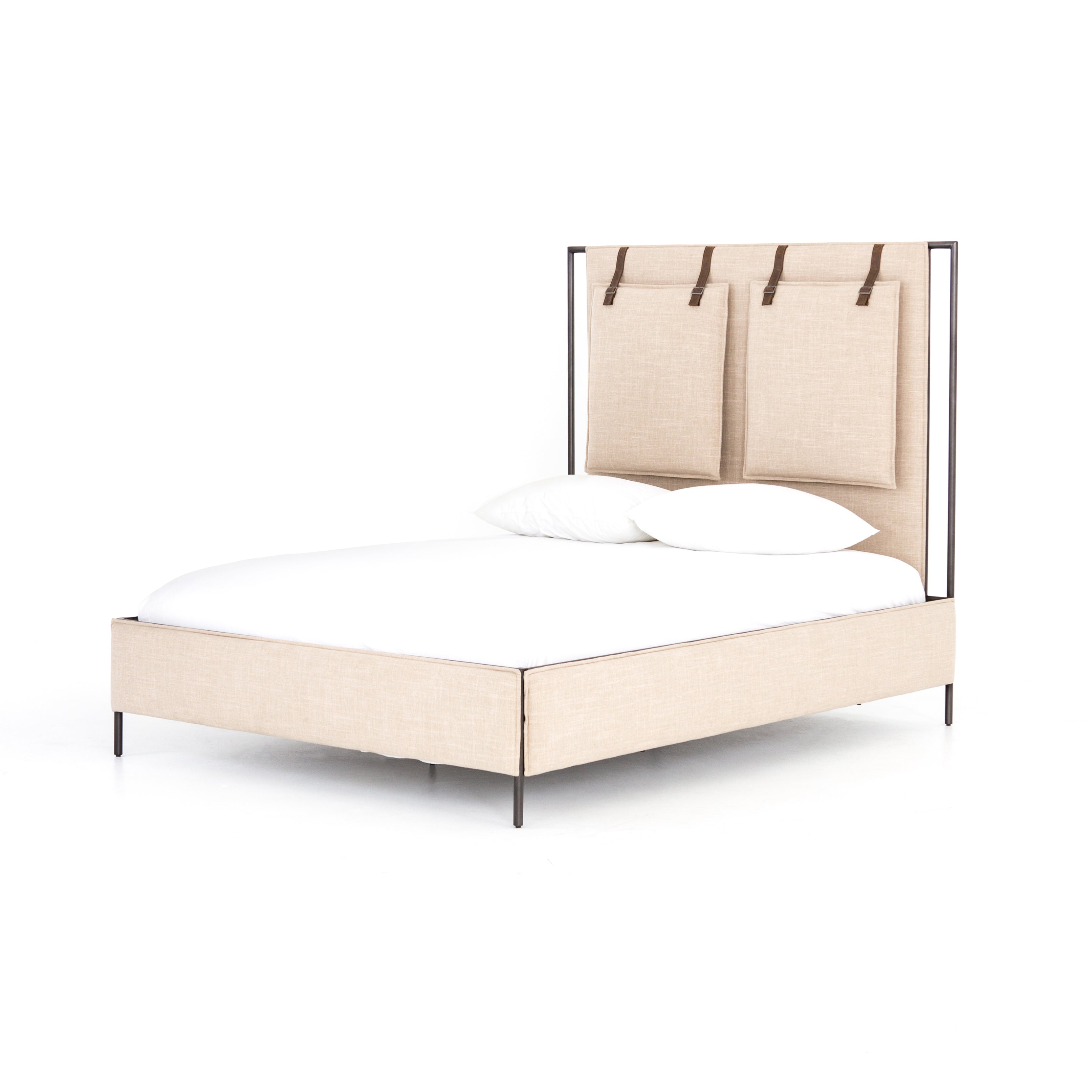 Safari styling gets a modern reboot with this Leigh Upholstered Bed. Linen-blend upholstery of neutral taupe lays a texture-rich base for a forward-thinking bedroom look. Brown leather straps secure decorative headboard pillows, suspended for eye-catching effect. Box spring required.