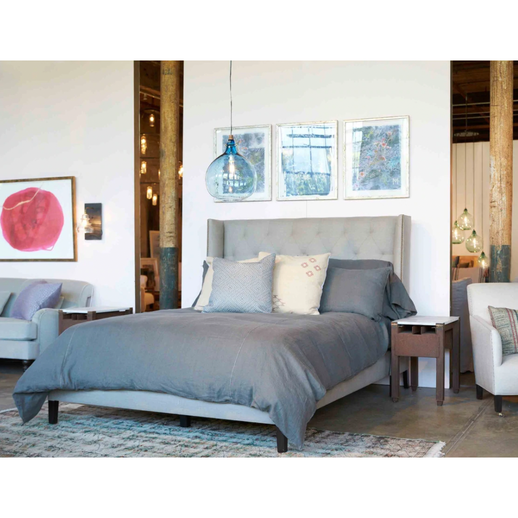 Elevate your sleep situation with this Francesca Upholstered Bed by Cisco Home. With a tall back and exposed wood legs, this will complete the look for any bedroom!
