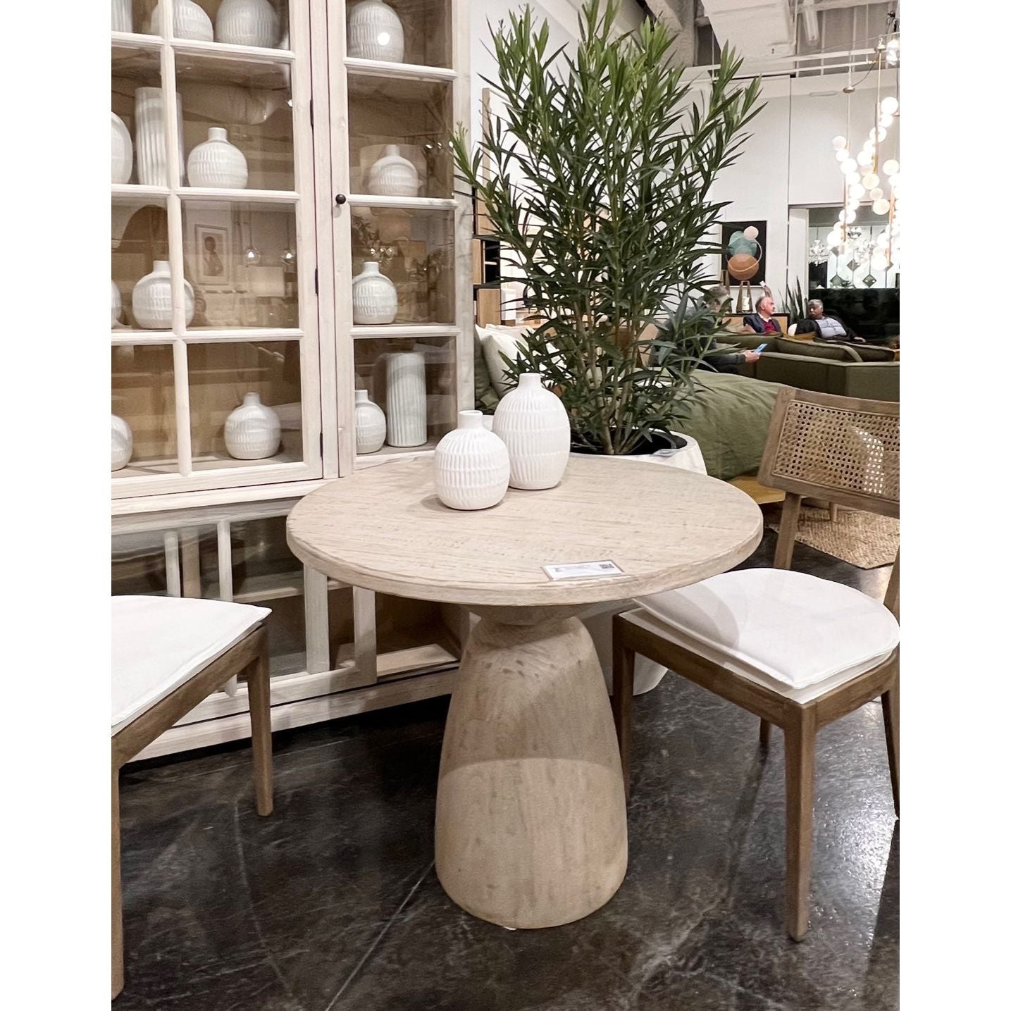 Featuring Cabrera Bistro Table by Dovetail at Amethyst Home. We love the curves and structure of this Cabrera Bistro Table. It is meticulously finished by hand, therefore there may be slight variations in color, making each piece one-of-a-kind.

Material: Reclaimed Pine WoodFinish: Light Warm Wash Finish / Natural FinishWidth: 36 in Depth: 36 in Height: 30 in Volume: 22.5 cu ft Weight: 88 lbs. Amethyst Home provides interior design services, furniture, rugs, and lighting in the Malibu metro area.