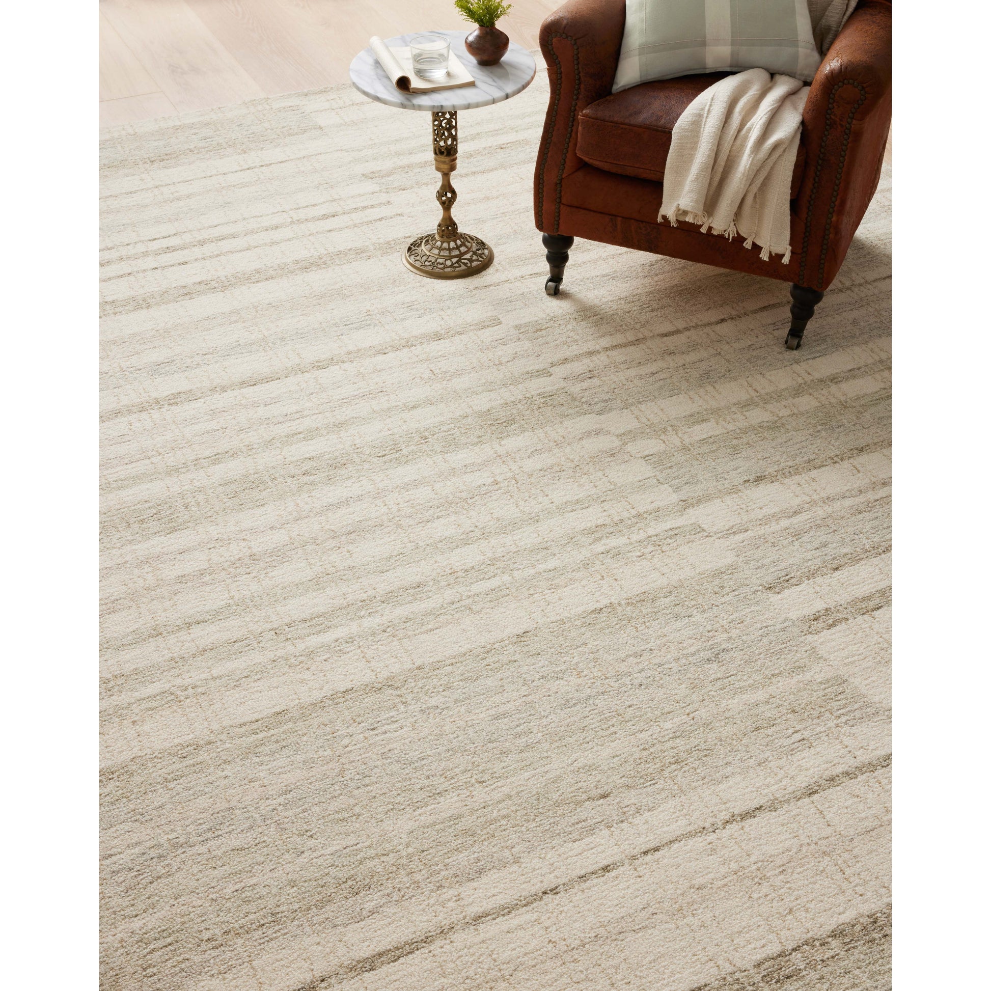 Green is totally in and we are here for it! The Chris Natural / Sage rug reminds us of our favorite casual, tonal stripe hemp rugs. Amethyst Home provides interior design services, furniture, rugs, and lighting in the Dallas metro area.