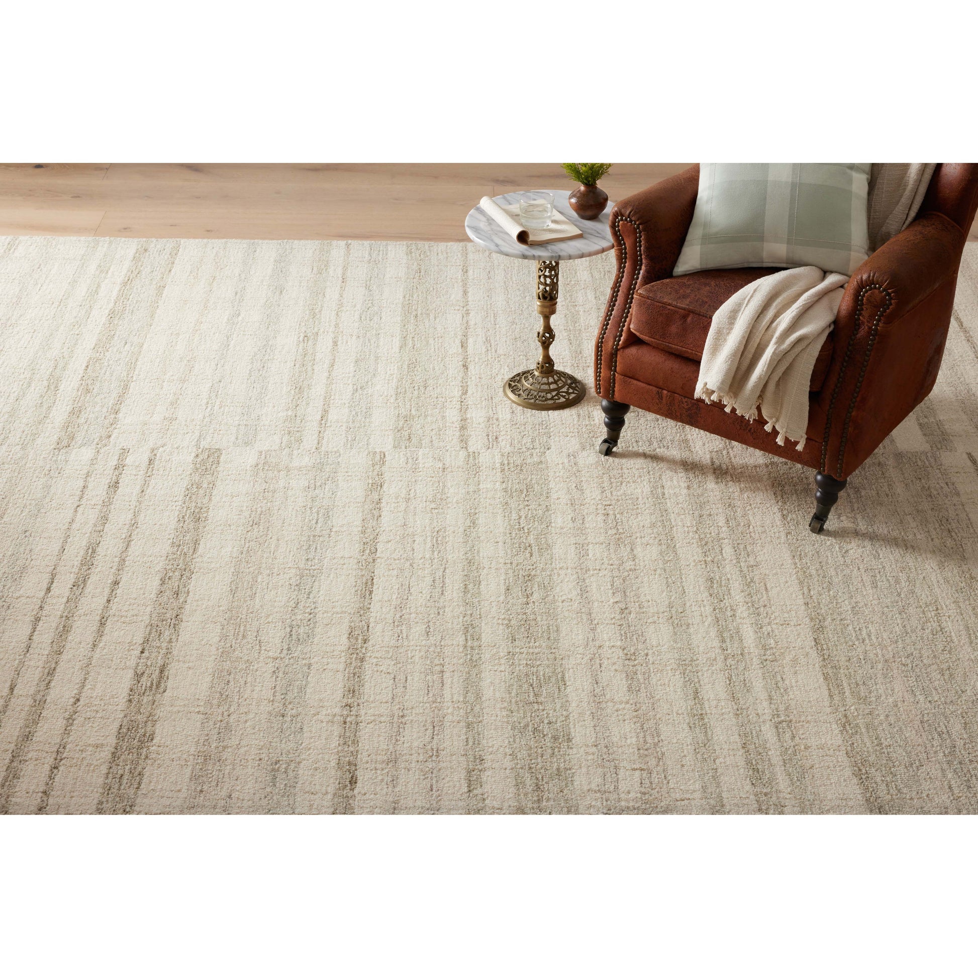 Green is totally in and we are here for it! The Chris Natural / Sage rug reminds us of our favorite casual, tonal stripe hemp rugs. Amethyst Home provides interior design services, furniture, rugs, and lighting in the Salt Lake City metro area.