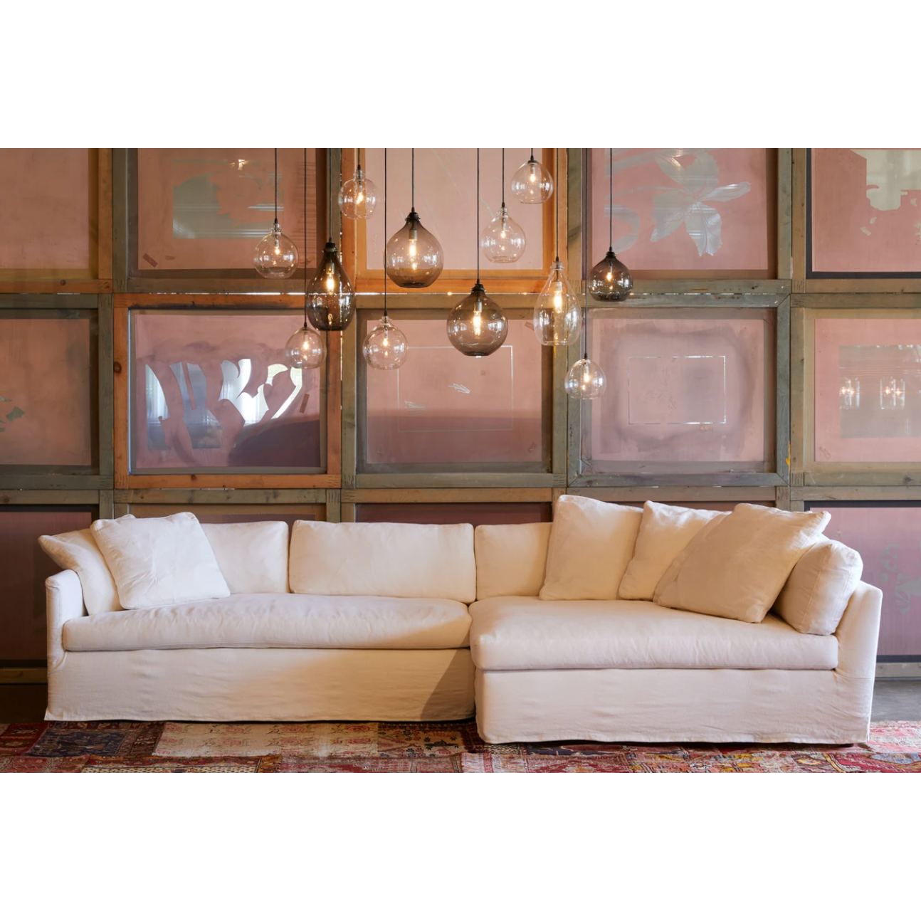 Featuring Harbor 2 Piece Sectional by Cisco Brothers at Amethyst Home. A chic, yet simple design, the Gunner Upholstered Sofa by Cisco Brothers boasts a streamlined frame supported by tapered legs. This sofa is beautifully detailed, with piping on the body and top stitch on cushions. It has a traditional yet sleek look, ideal for entertaining.  Photographed in.  Amethyst Home provides interior design, new home construction design consulting, vintage area rugs, and lighting in the Tampa metro area.