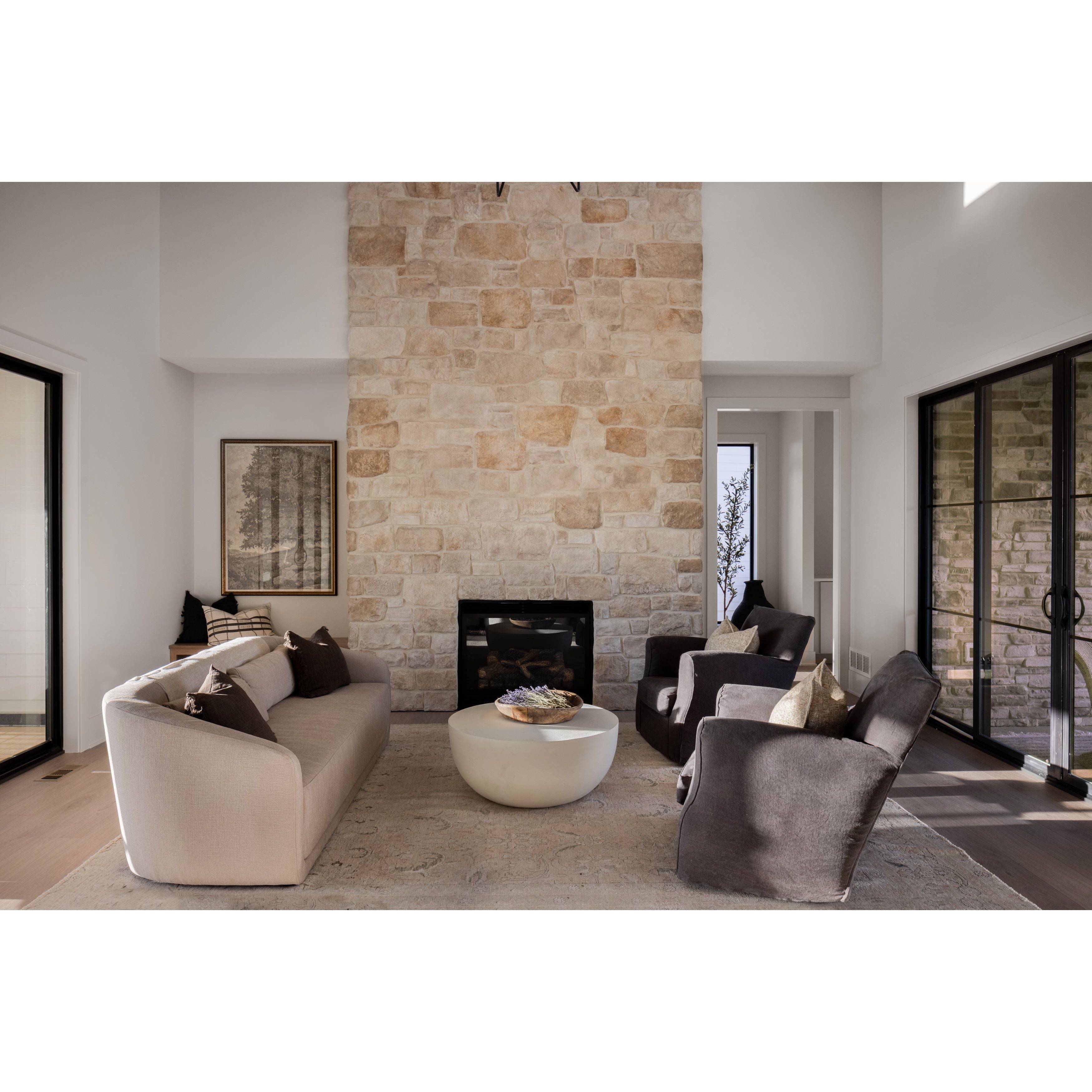 The Damien Swivel Chair features classic rounded arms, a supportive high back, and a supportive loose seat cushion, resting upon a playful swivel base. Amethyst Home provides interior design, new home construction design consulting, vintage area rugs, and lighting in the Seattle metro area.