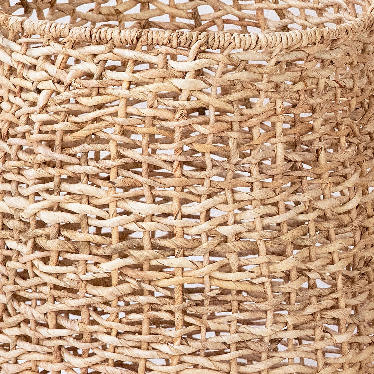 Create a warm and relaxed look in your home with this set of decorative baskets. These baskets are crafted from natural, hand-braided Abaca fibers, a durable material known for its exceptional strength and flexibility. With their organic and subtle expression, these baskets will make a stunning addition to a laundry room or bathroom. Amethyst Home provides interior design, new home construction design consulting, vintage area rugs, and lighting in the Scottsdale metro area.