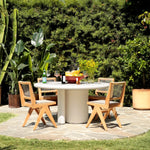 Featuring Marco White Concrete Dining Table by Dovetail at Amethyst Home. A contemporary and modern coastal design that adds exceptional detail to anywhere it's placed. It features a stylish contrast between clean lines and gently rounded edges. The exquisite white finish compliments the streamlined silhouette that instantly elevates a sophisticated dinner. T. Amethyst Home provides interior design, new home construction design consulting, vintage area rugs, and lighting in the Seattle metro area.