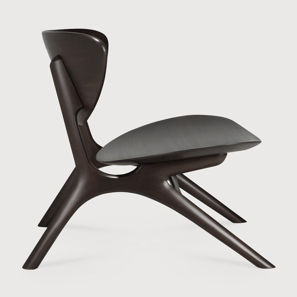 Beauty is in the eye of the beholder. With sleek, angular, front legs and flowing smooth connections, the Eye lounge chair is a hallmark solid wooden seating design. The curved backrest, reminiscent of a winked eye, inspired the name of the chair. Think subtle elegance with a stylish edge. Amethyst Home provides interior design, new home construction design consulting, vintage area rugs, and lighting in the Dallas metro area.
