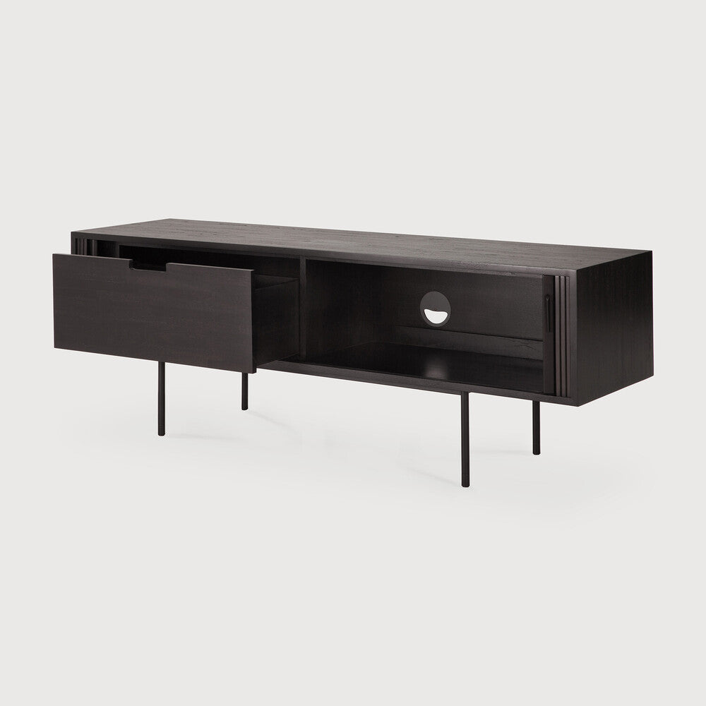 Featuring Roller Max TV Cupboard Teak black by Ethnicraft at Amethyst Home. The Roller Max collection is remarkable in its design, distinguished with its stacked wood-stick effect. The TV cupboard offers functional storage in an eye-catching design, resulting in an elegant and sophisticated item for both residential and commercial spaces.
Overall Dimensions: . Amethyst Home provides interior design, new home construction design consulting, vintage area rugs, and lighting in the Houston metro area.