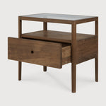 With its one drawer, open space and slightly tapered legs, the Spindle bedside table is the perfect no-nonsense companion for the striking Spindle bed. Reclaimed teak offers a truly unique finish for each and every item — the origin of each hand-finished piece of furniture carries its own story in its material. Amethyst Home provides interior design, new home construction design consulting, vintage area rugs, and lighting in the Boston metro area.