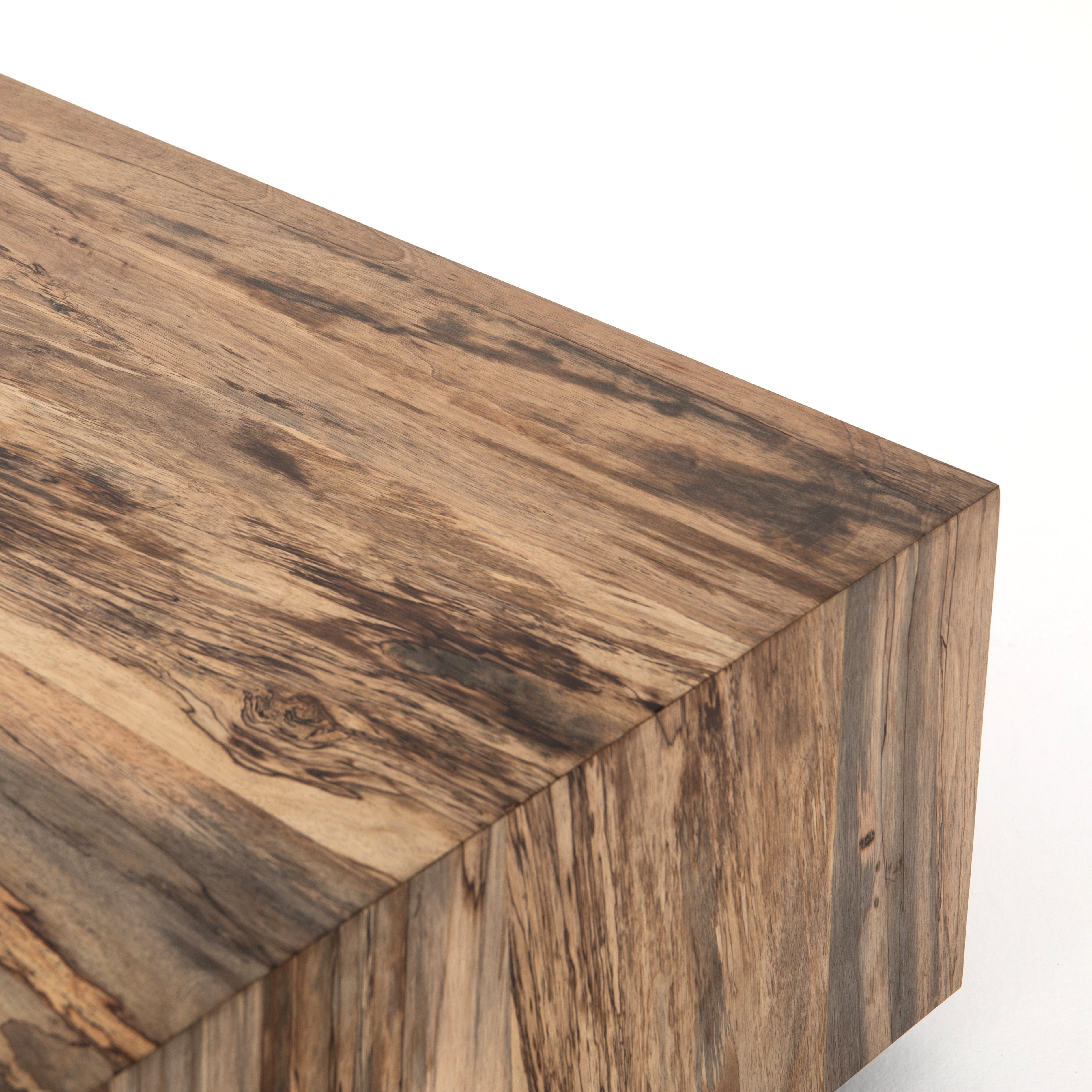 We are obsessed with the spalted pimavera coloring of this Hudson Spalted Primavera Square Coffee Table. A stunning piece to add to any living room or loung area. Reflective of woods' natural character, a slight color variance is possible.  Overall Dimensions: 40"w x 40"d x 15"h Materials: Primavera, Iron