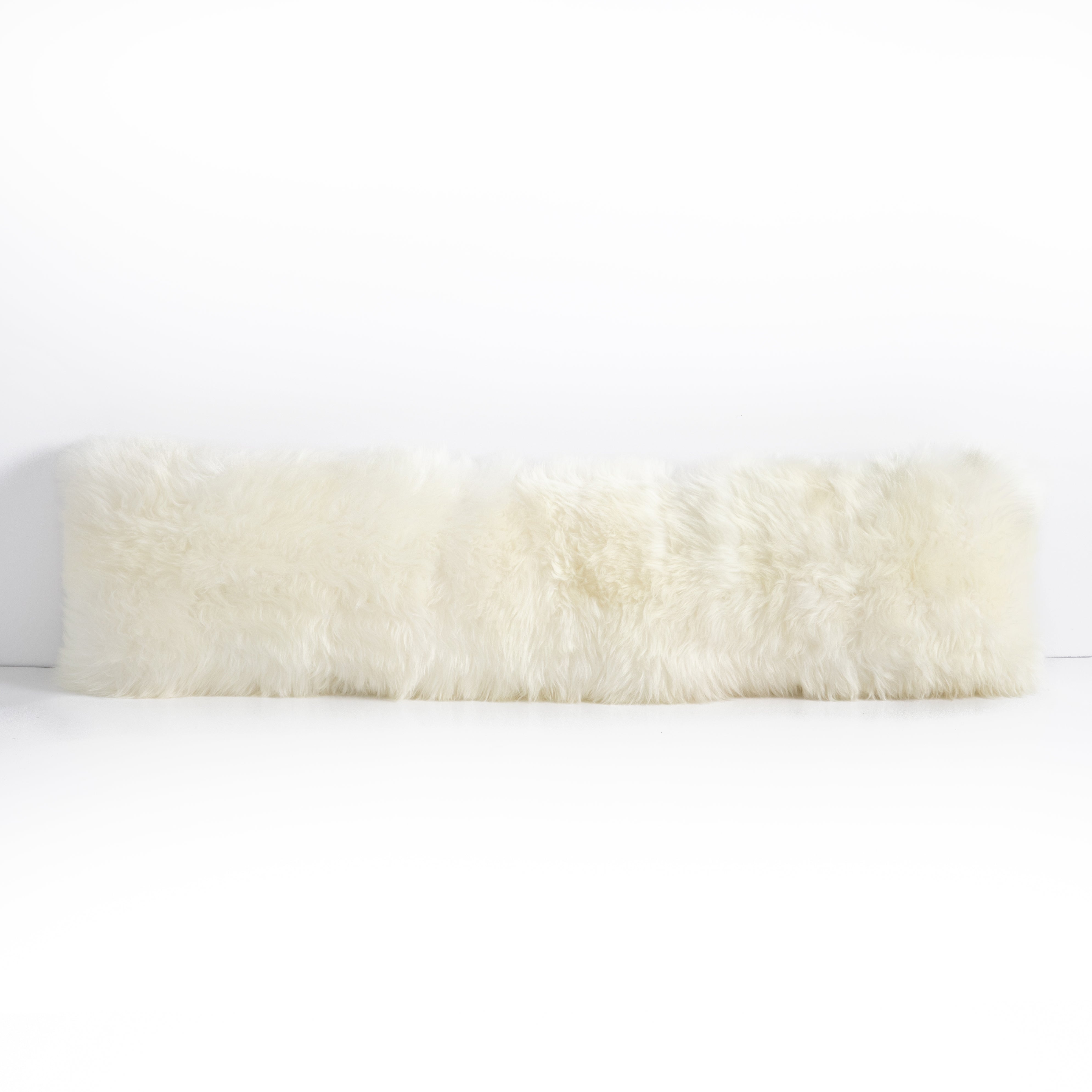 This Lalo Lambskin Lumbar Pillow is made of 100% unshorn sheekskin and brings all the texture to your bedroom or living room sofa.   Overall Dimensions: 48.00"w x 0.50"d x 12.00"h Colors: White Lambskin Materials: 100%Unshornsheepskin