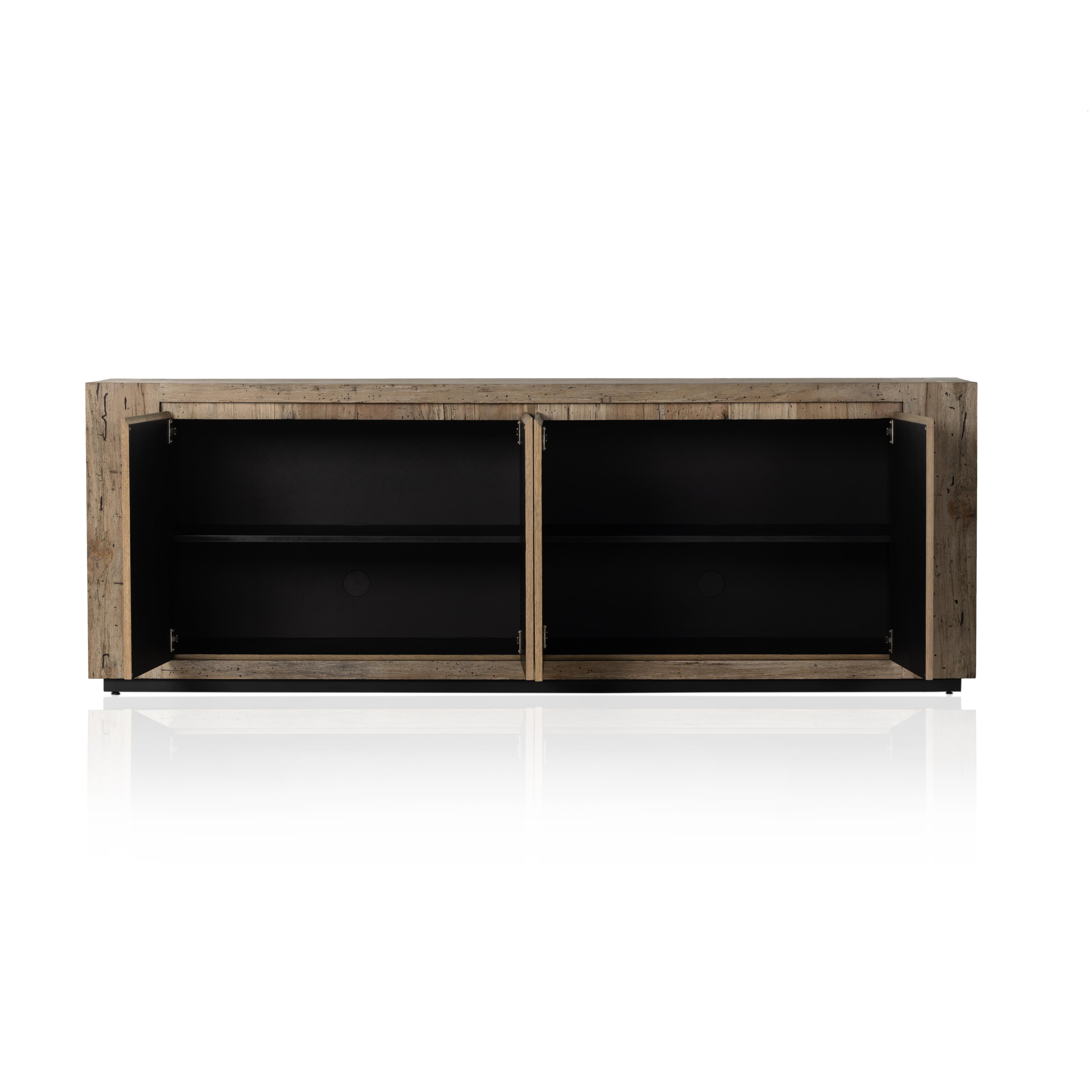 Made from thick-cut oak veneer with a faux rustic finish made to emulate wormwood, this low, large-scale sideboard features chunky squared legs and dovetail joinery detailing. Amethyst Home provides interior design, new home construction design consulting, vintage area rugs, and lighting in the Houston metro area.