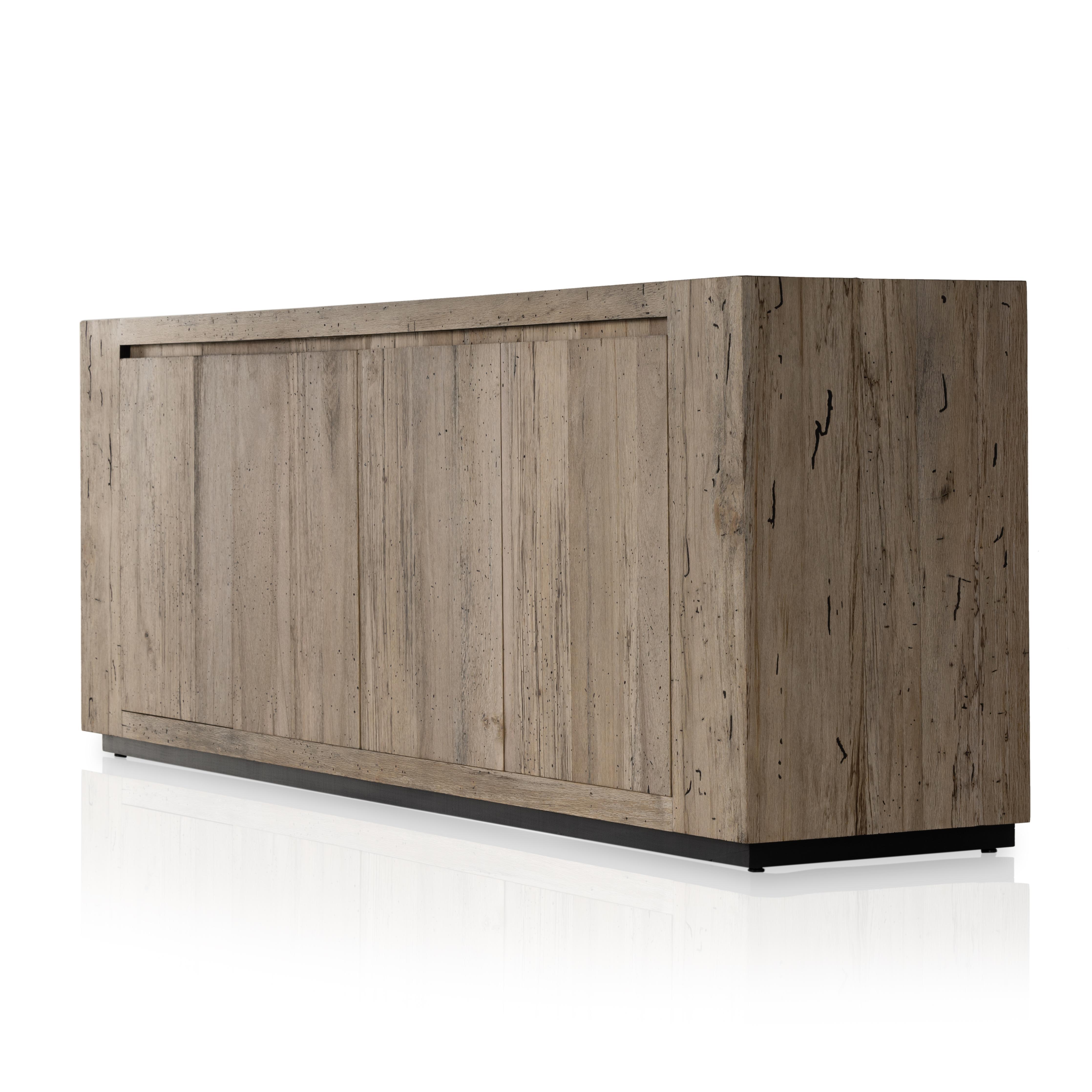 Made from thick-cut oak veneer with a faux rustic finish made to emulate wormwood, this low, large-scale sideboard features chunky squared legs and dovetail joinery detailing. Amethyst Home provides interior design, new home construction design consulting, vintage area rugs, and lighting in the Newport Beach metro area.