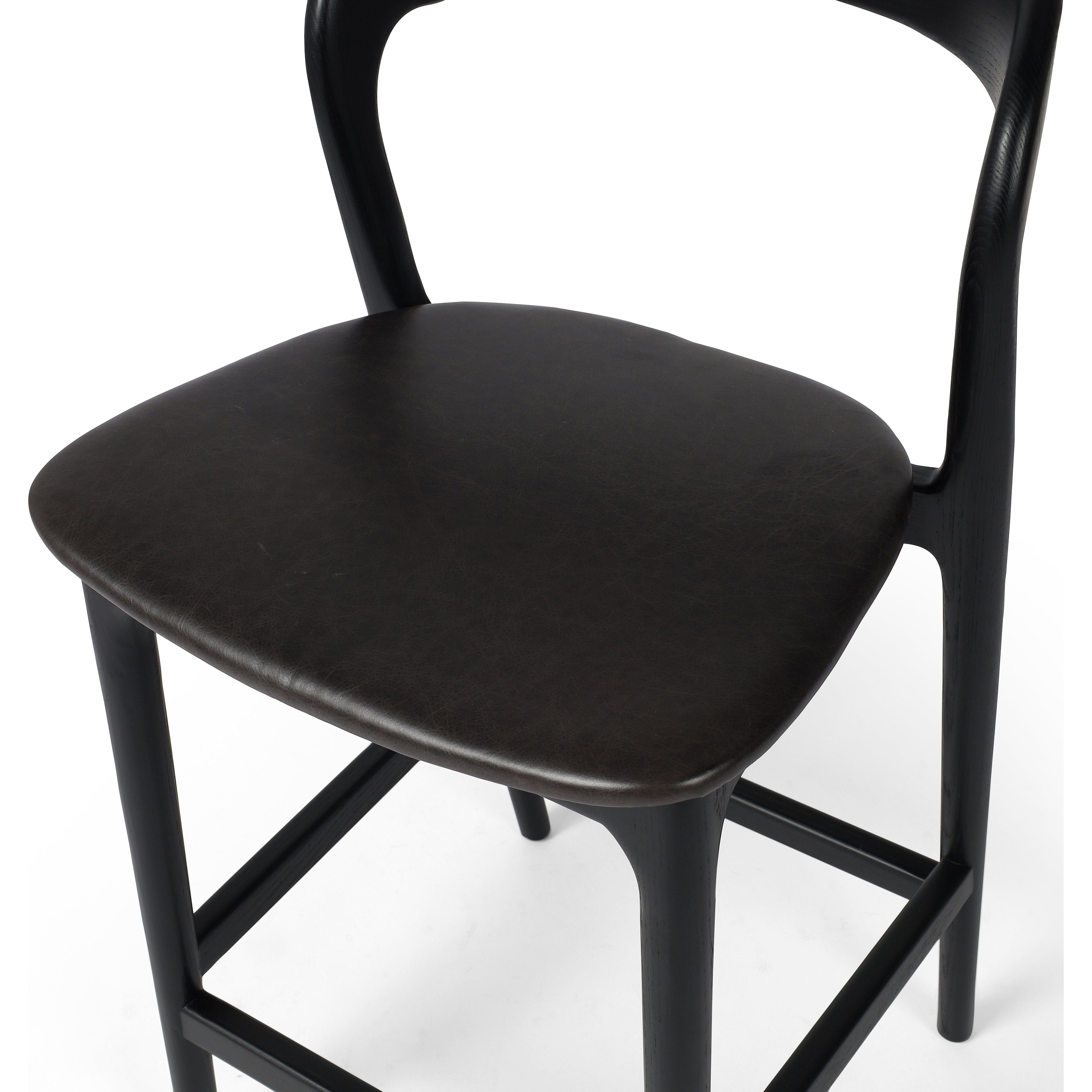 Featuring Amare Sonoma Black Bar + Counter Stool by Four Hands at Amethyst Home. Modern monochrome, perfectly sized for the counter. Inspired by simple Scandinavian styling, black-finished solid ash forms a shapely open frame for black top-grain leather seating.
Overall Counter Stool Dimensions: 19"w x 22"d x 39"hOverall Bar Stool Dimensions: 19"w x 22"d x 43"hColors: Black , Sonoma B. Amethyst Home provides interior design, new construction, custom furniture and area rugs in the Austin metro area