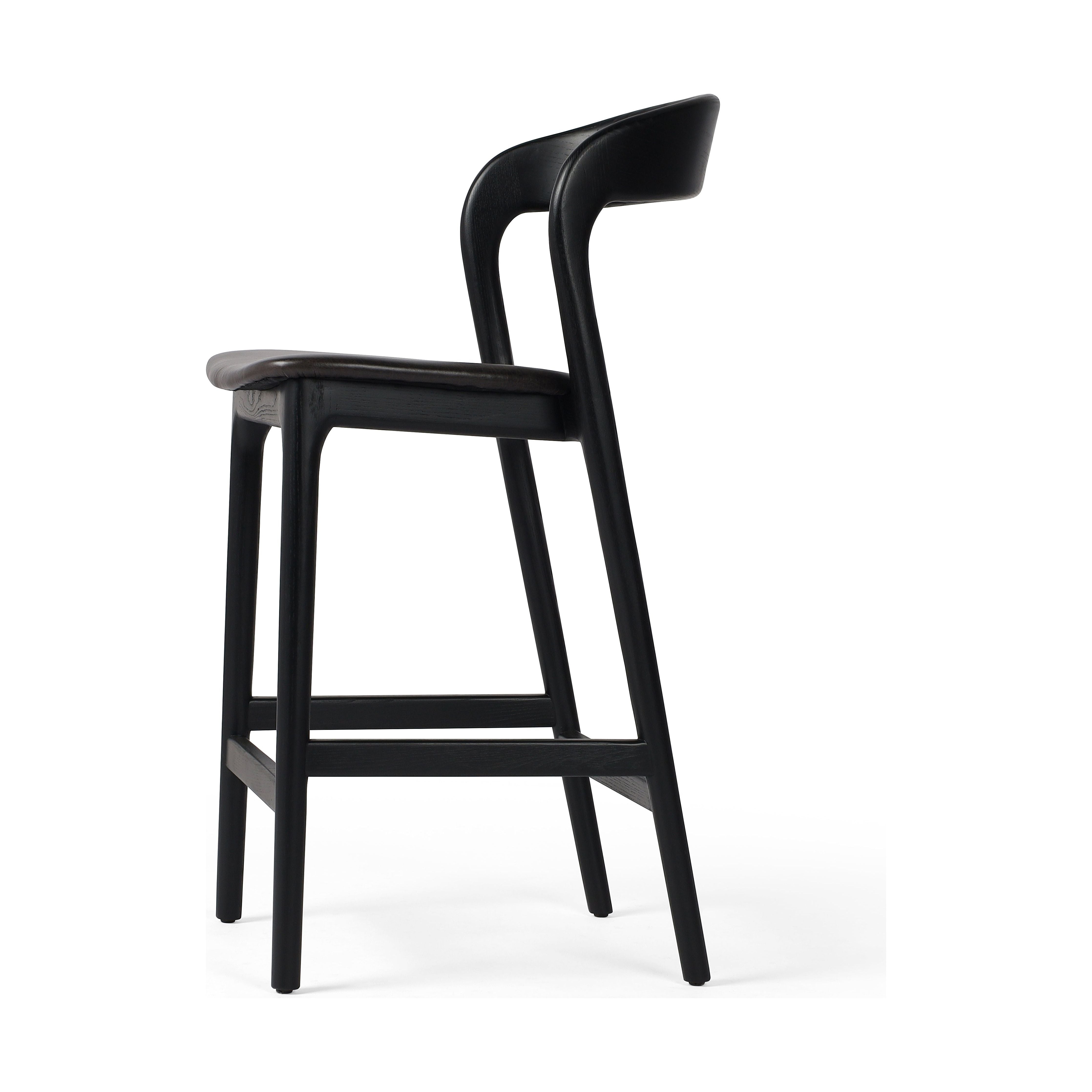Featuring Amare Sonoma Black Bar + Counter Stool by Four Hands at Amethyst Home. Modern monochrome, perfectly sized for the counter. Inspired by simple Scandinavian styling, black-finished solid ash forms a shapely open frame for black top-grain leather seating.
Overall Counter Stool Dimensions: 19"w x 22"d x 39"hOverall Bar Stool Dimensions: 19"w x 22"d x 43"hColors: Black , Sonoma . Amethyst Home provides interior design, new construction, custom furniture and area rugs in the Houston metro area