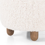 Place this round Aniston Andes Natural Ottoman just about anywhere for a subtle retro vibe. Upholstered in a faux Mongolian shearling with a high pile fur. Parawood legs are wirebrushed for a warm, vintage feel. Amethyst Home provides interior design services, furniture, rugs, and lighting in the Des Moines metro area.