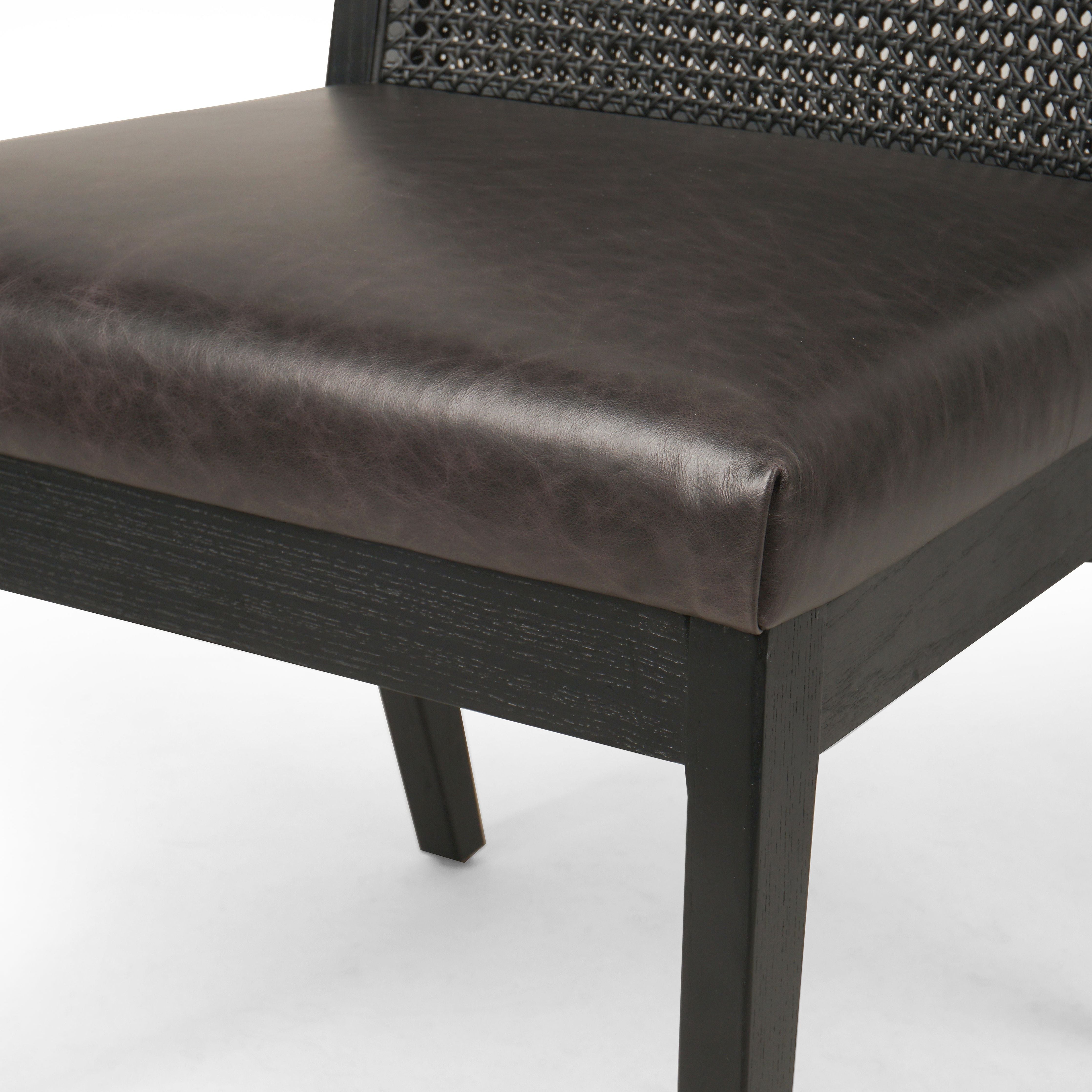 Featuring Antonia Black Armless Dining Chair by Four Hands at Amethyst Home. Mixed materials refresh a retro style. Brushed ebony cane frames top-grain leather seating with slight distressing, bringing more character to the seat.
Collection: KestonColors: Brushed Ebony Cane ,Brushed Ebony ,Sonoma BlackMaterials: Cane ,Solid Nettlewood ,Top Grain LeatherOverall Dimensions: 22.25"W . Amethyst Home provides interior design, new construction, custom furniture, and area rugs in the Portland metro area.