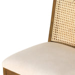 Mixed materials refresh retro stool seating. Light-toasted nettlewood frames a textural inlay of natural cane for a clean, monochromatic look, with a light, linen-blend seat of high-performance fabric brings smart sensibility to bar-style seating. Amethyst Home provides interior design, new home construction design consulting, vintage area rugs, and lighting in the Monterey metro area.