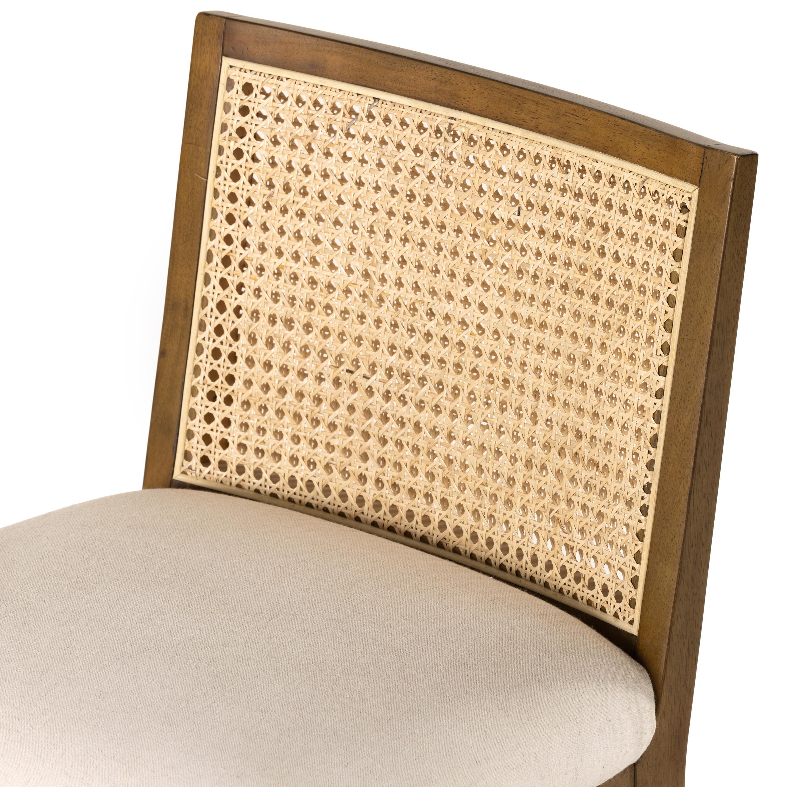 Mixed materials refresh retro stool seating. Light-toasted nettlewood frames a textural inlay of natural cane for a clean, monochromatic look, with a light, linen-blend seat of high-performance fabric brings smart sensibility to bar-style seating. Amethyst Home provides interior design, new home construction design consulting, vintage area rugs, and lighting in the Portland metro area.