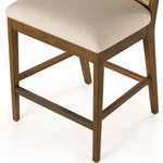 Mixed materials refresh retro stool seating. Light-toasted nettlewood frames a textural inlay of natural cane for a clean, monochromatic look, with a light, linen-blend seat of high-performance fabric brings smart sensibility to bar-style seating. Amethyst Home provides interior design, new home construction design consulting, vintage area rugs, and lighting in the Scottsdale metro area.