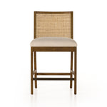 Mixed materials refresh retro stool seating. Light-toasted nettlewood frames a textural inlay of natural cane for a clean, monochromatic look, with a light, linen-blend seat of high-performance fabric brings smart sensibility to bar-style seating. Amethyst Home provides interior design, new home construction design consulting, vintage area rugs, and lighting in the Seattle metro area.