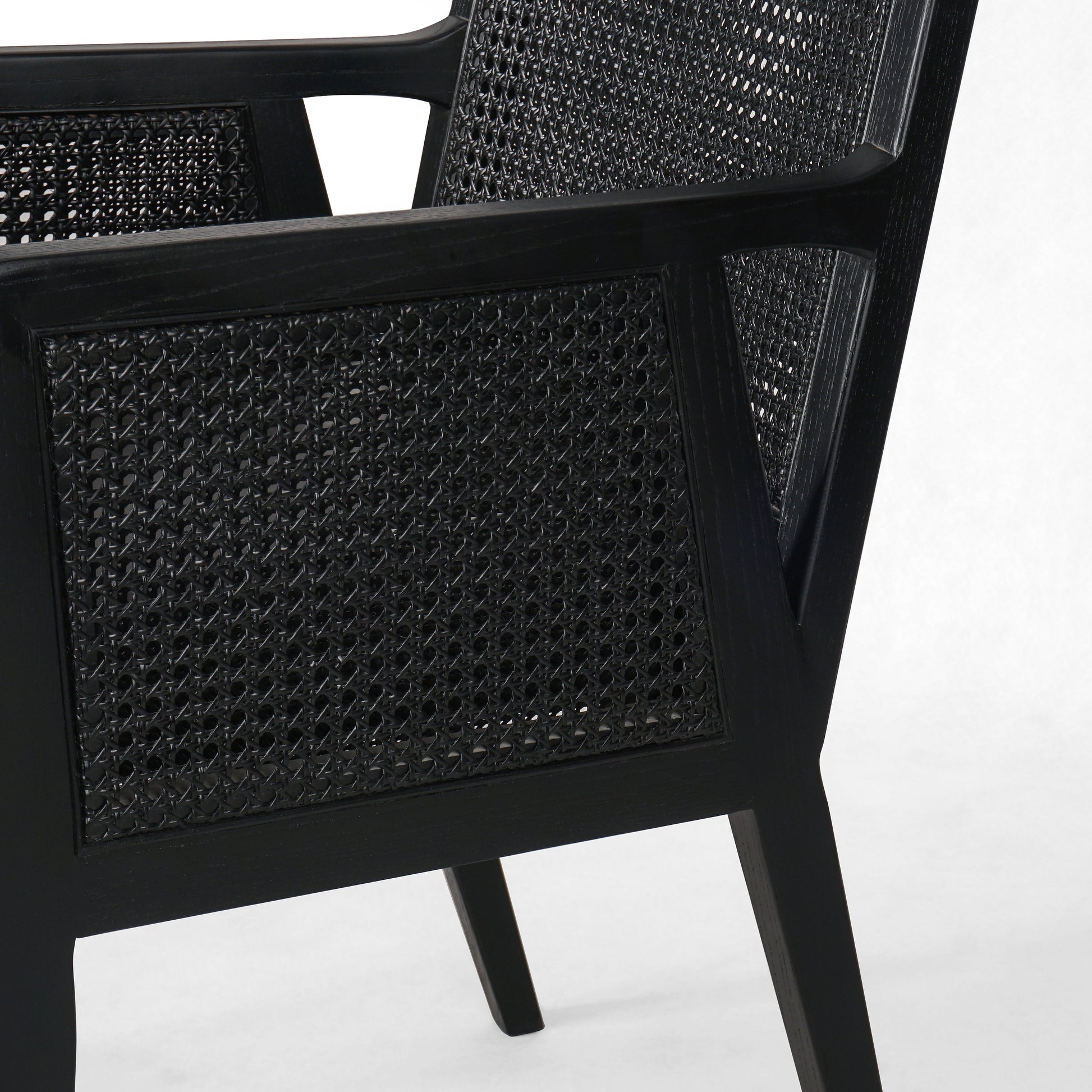 Ebony-brushed parawood frames a textural cane inlay, with top-grain leather seating in a chic black. Amethyst Home provides interior design, new construction, custom furniture, and area rugs in the Alpharetta metro area.