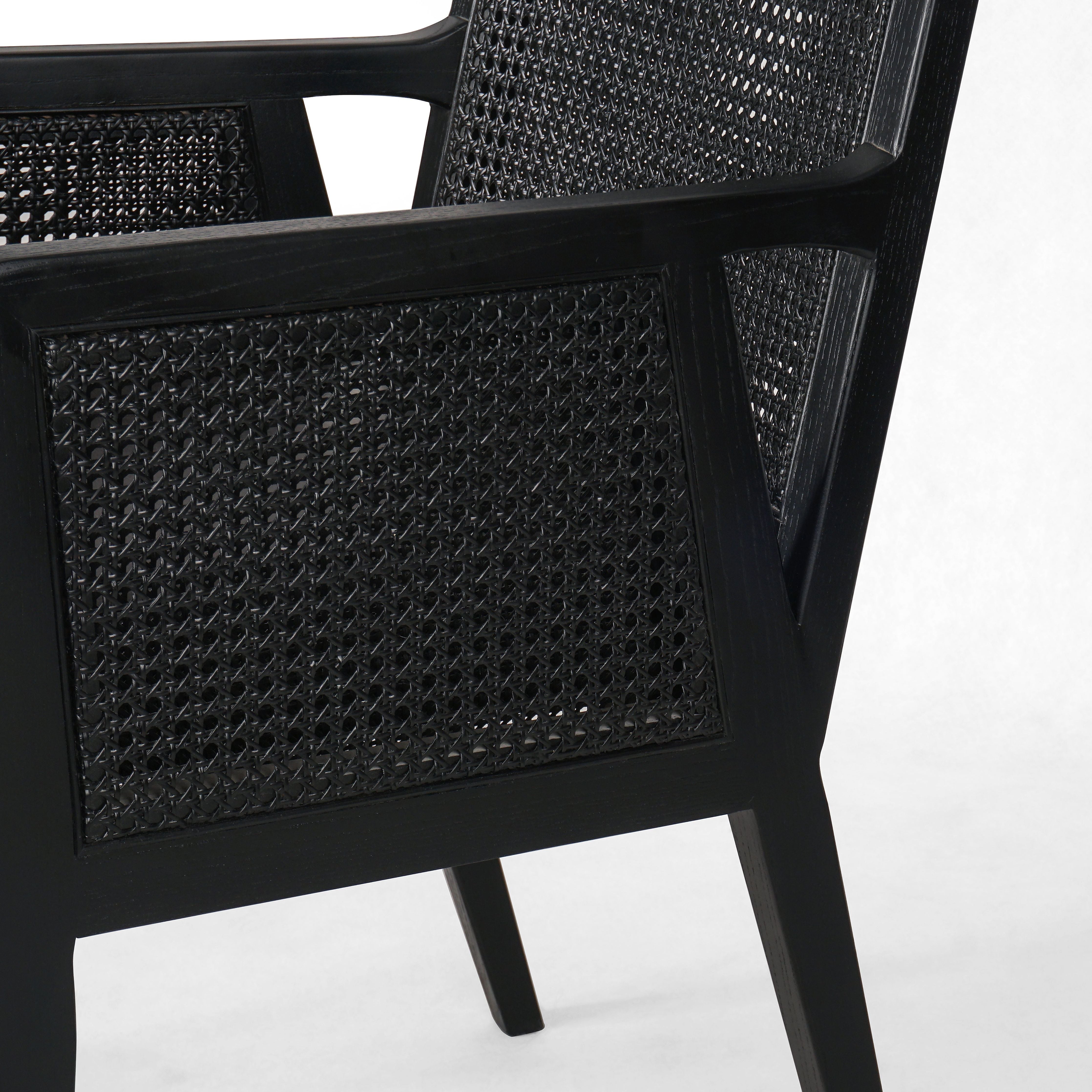 Ebony-brushed parawood frames a textural cane inlay, with top-grain leather seating in a chic black. Amethyst Home provides interior design, new construction, custom furniture, and area rugs in the Alpharetta metro area.