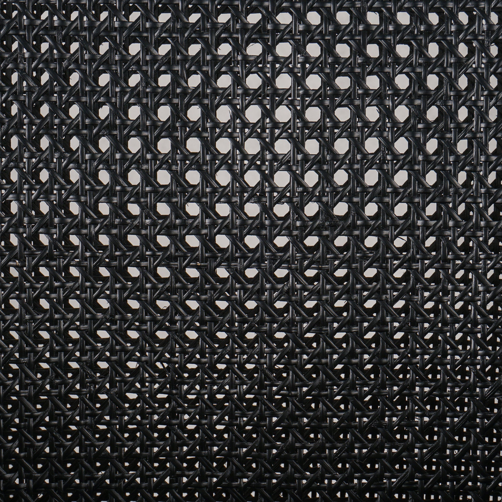 Ebony-brushed parawood frames a textural cane inlay, with top-grain leather seating in a chic black. Amethyst Home provides interior design, new construction, custom furniture, and area rugs in the Seattle metro area.