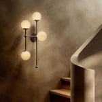 Featuring Armstrong Black Gunmetal Opal Matte Glass 4 L Sconce by Four Hands at Amethyst Home. Matte glass spheres seem to extend and reach across smooth brass rods. Each globe is individually blown, shaped and sculpted by hand through a one-hour process. Matte globes are specially manufactured to evenly diffuse light. The finish on the brass frame is achie. Amethyst Home provides interior design, new home construction design consulting, vintage area rugs, and lighting in the Calabasas metro area.