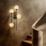 Featuring Armstrong Black Gunmetal Marbled Matte Glass 4 L Sconce by Four Hands at Amethyst Home. Marbled glass spheres seem to extend and reach across smooth brass rods. Each globe is individually blown, shaped and sculpted by hand through a one-hour process. The finish on the brass frame is achieved through a specialized process that turns the brass in. Amethyst Home provides interior design, new home construction design consulting, vintage area rugs, and lighting in the Laguna Beach metro area.