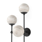 Featuring Armstrong Black Gunmetal Marbled Matte Glass 4 L Sconce by Four Hands at Amethyst Home. Marbled glass spheres seem to extend and reach across smooth brass rods. Each globe is individually blown, shaped and sculpted by hand through a one-hour process. The finish on the brass frame is achieved through a specialized process that turns the brass i. Amethyst Home provides interior design, new home construction design consulting, vintage area rugs, and lighting in the Newport Beach metro area.
